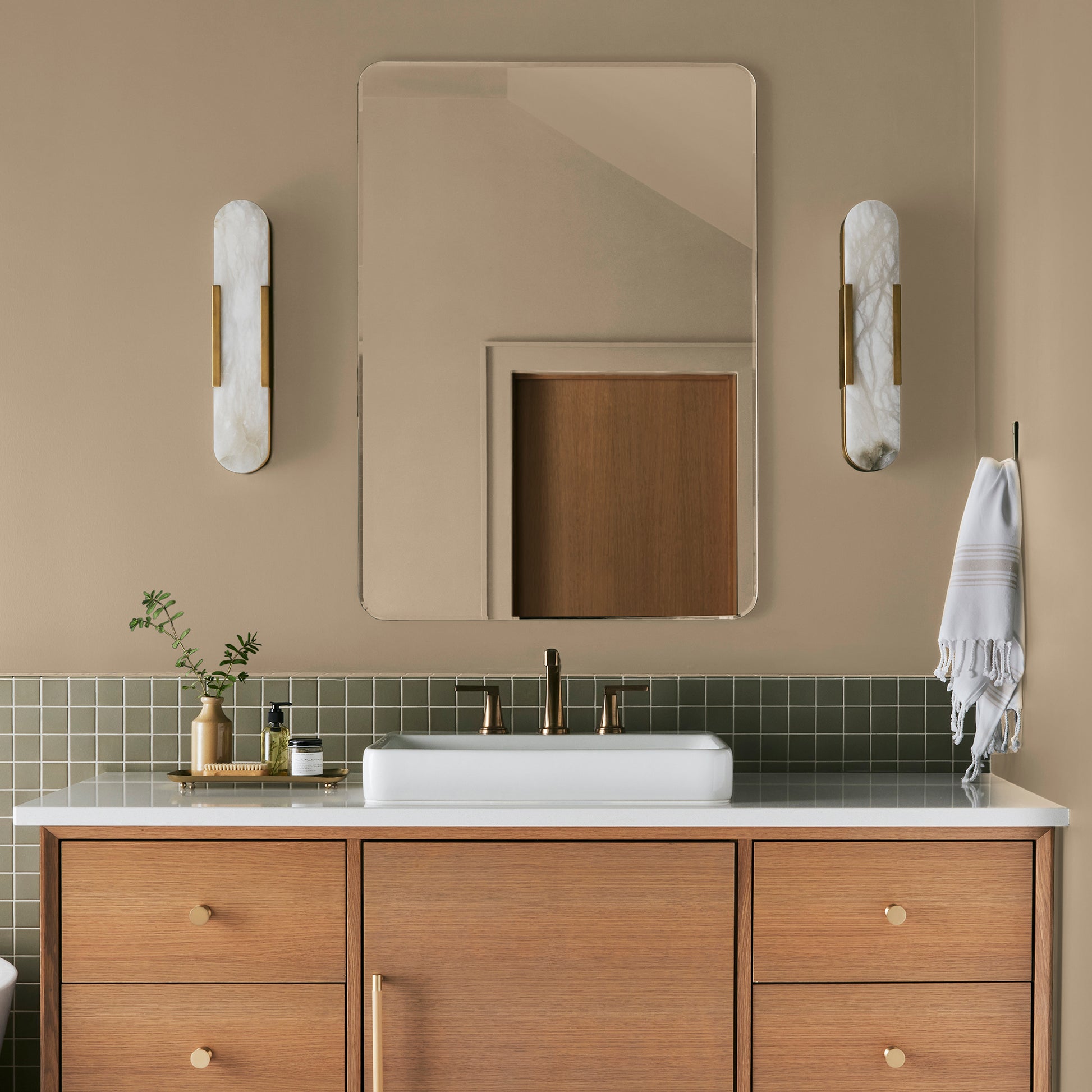 Light sandy gold interior paint named summer pear shown painted on bathroom wall