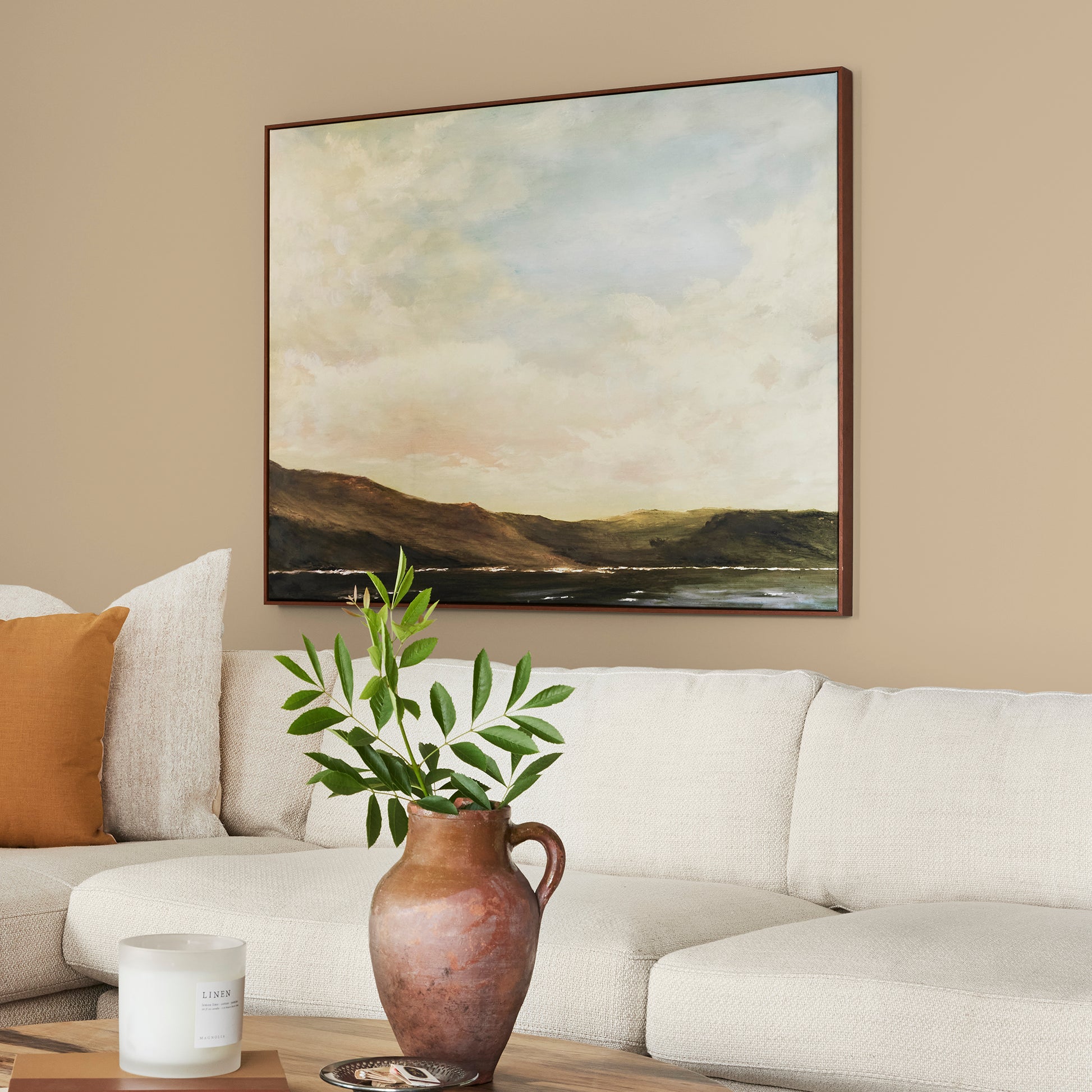 Light sandy gold interior paint named summer pear shown painted on living room wall