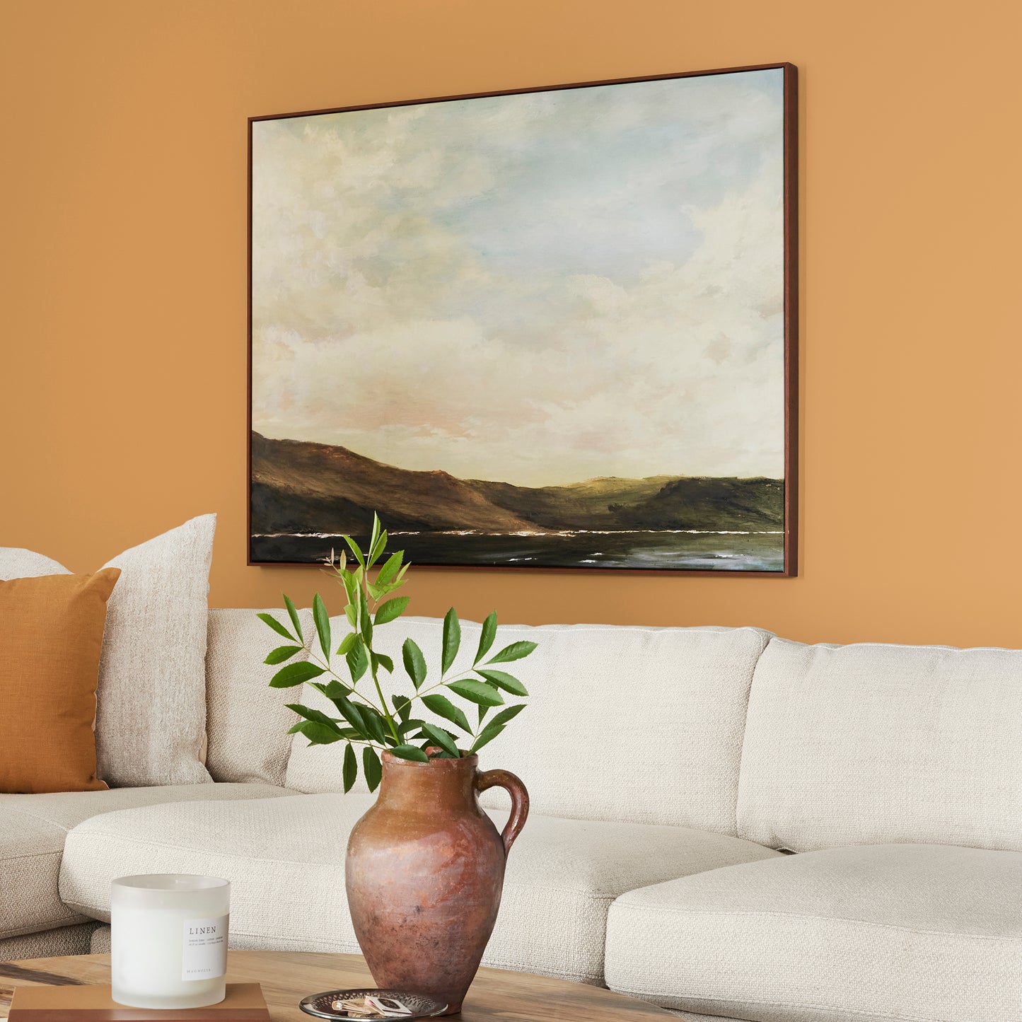 Rich ochre yellow interior paint named brushed clay shown painted on living room wall