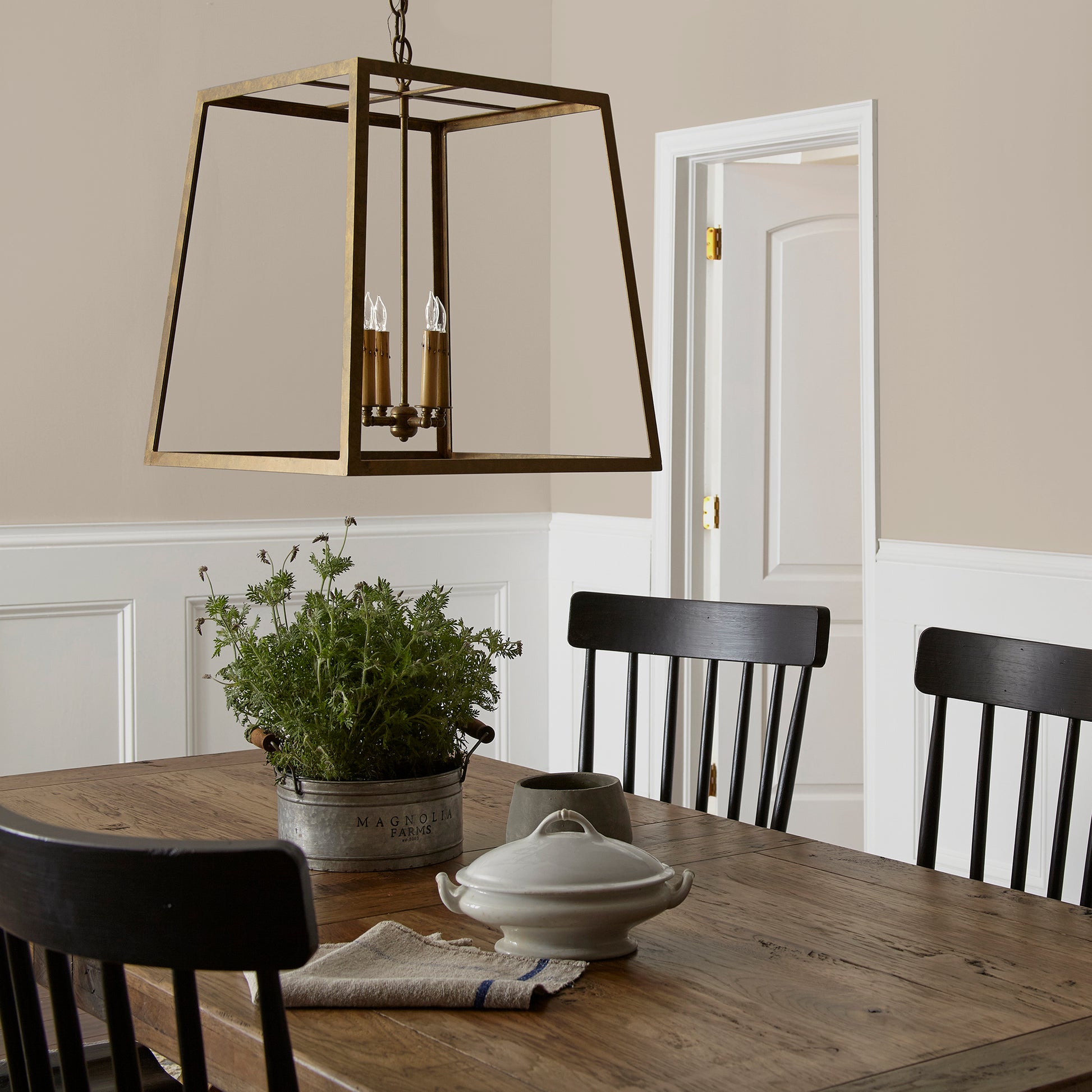 A khaki beige interior paint named solid wood shown painted on dining room wall