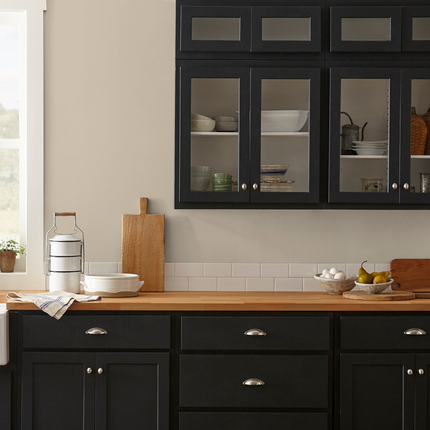 Cool beige dusted with hazel and cocoa interior paint named tapestry thread shown painted on kitchen wall