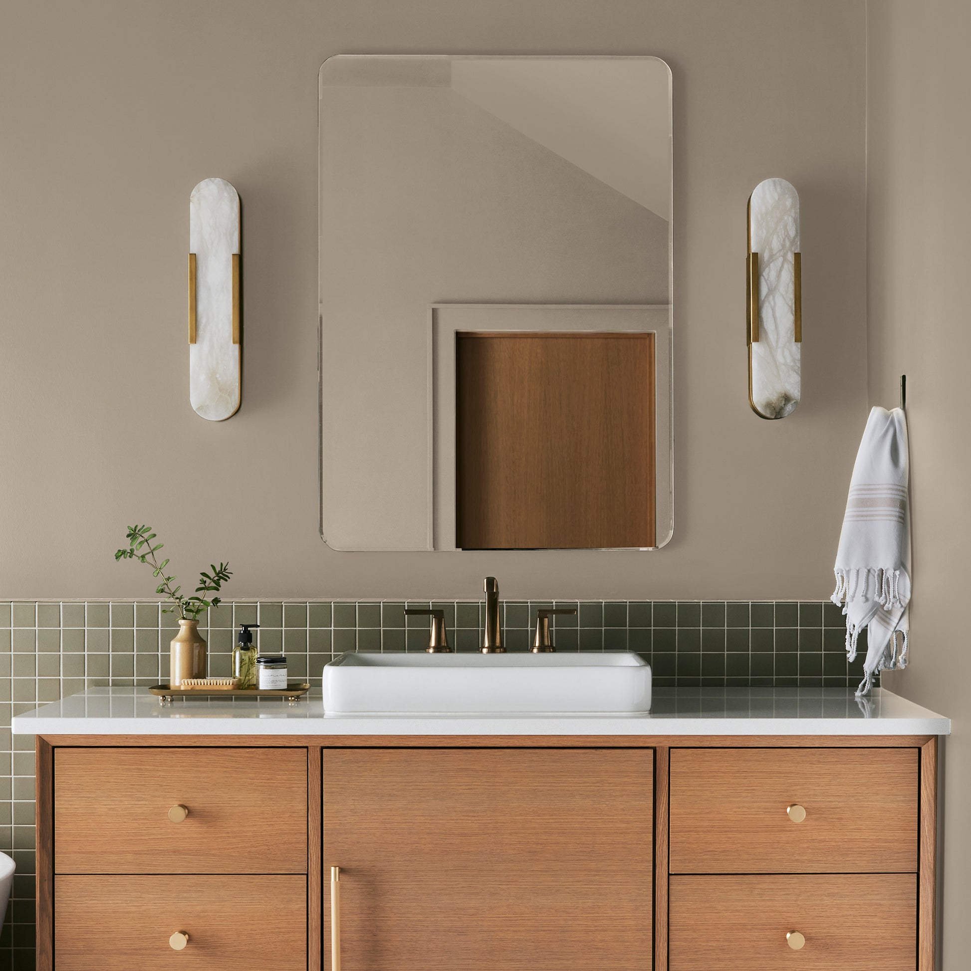 Tan and beige with notes of honey interior paint named embossed letter shown painted on bathroom wall