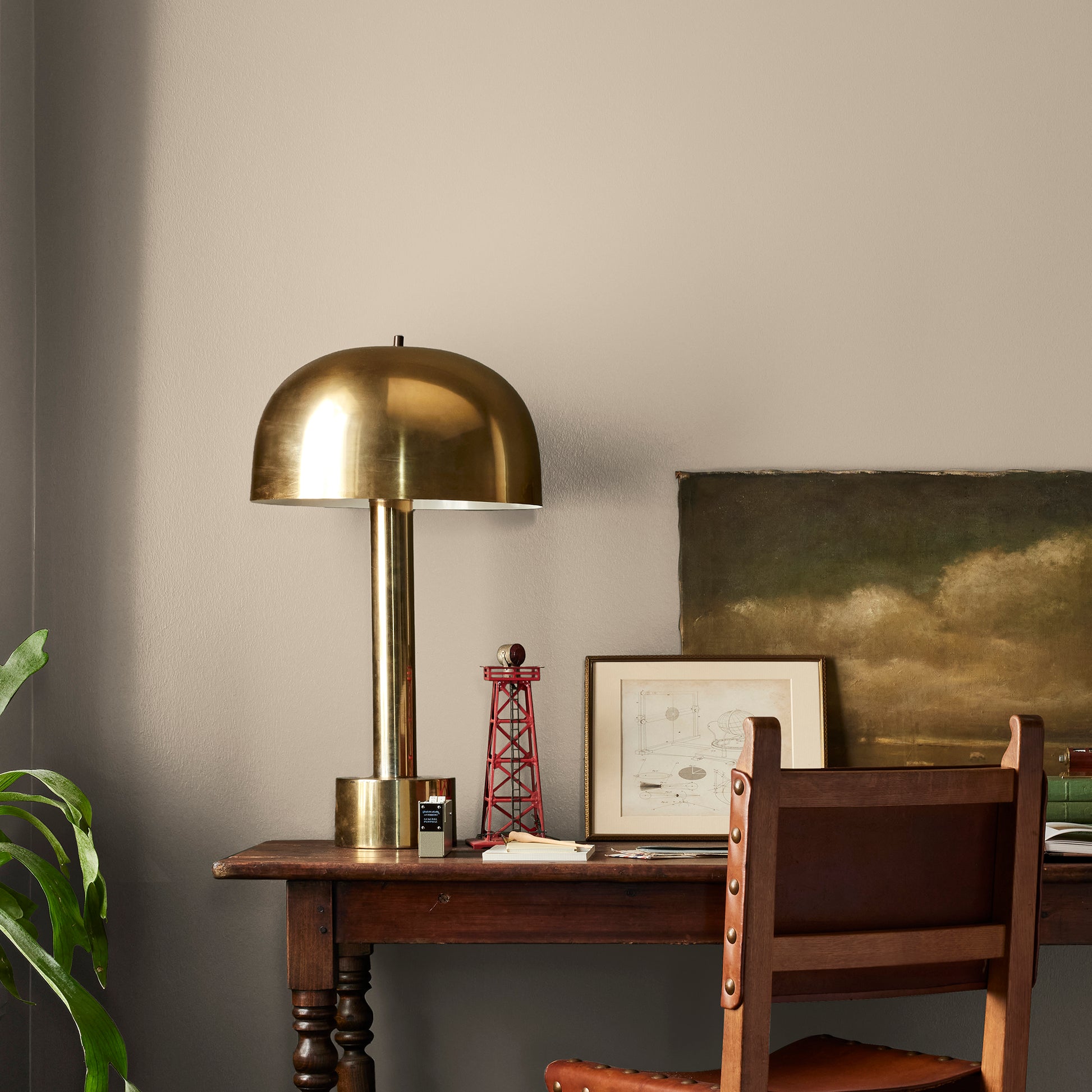 Tan and beige with notes of honey interior paint named embossed letter shown painted on bedroom wall