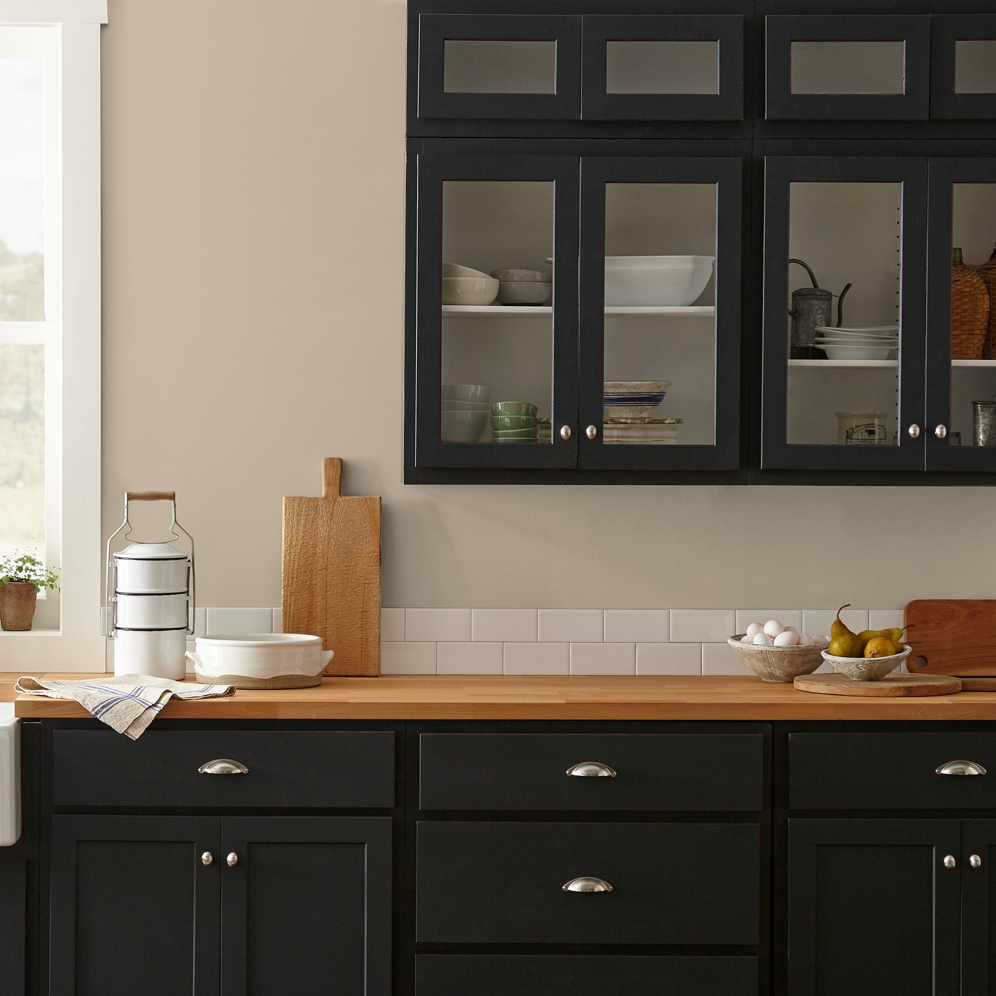 Tan and beige with notes of honey interior paint named embossed letter shown painted on kitchen wall