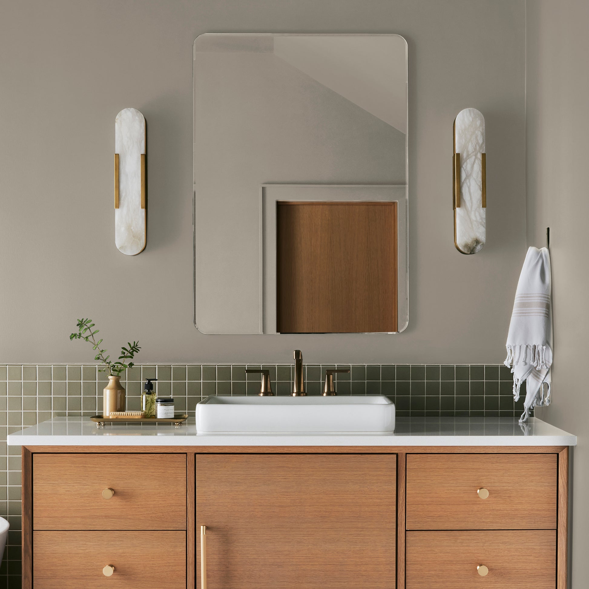 Mid-toned tan with a hint of green interior paint named renewed shown painted on bathroom wall