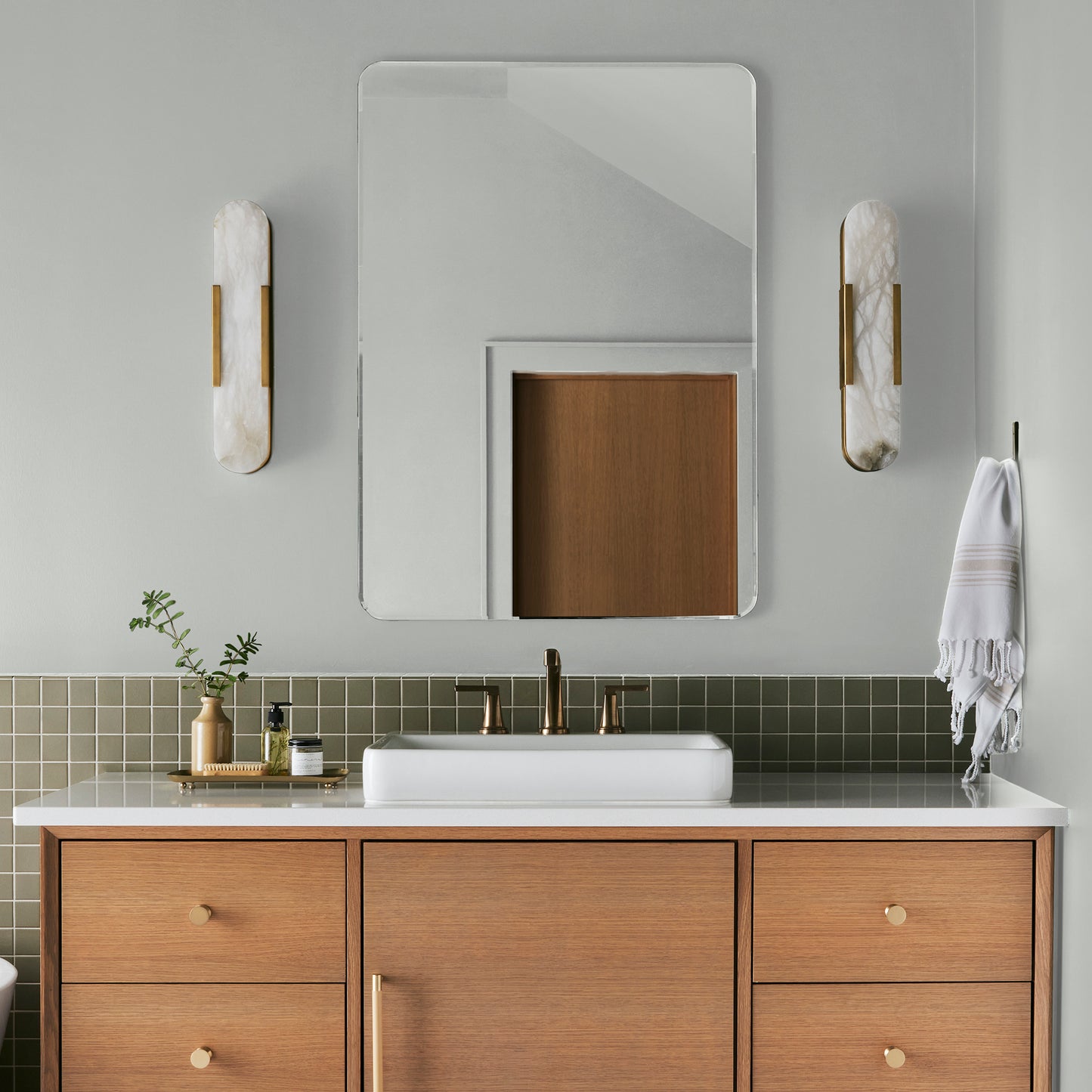 Almost white blended with gray tones interior paint named cloudy gray shown painted on bathroom wall