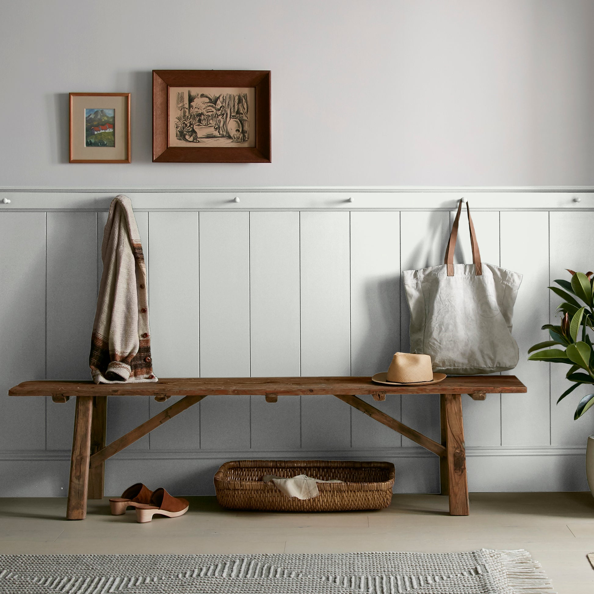 Almost white blended with gray tones interior paint named cloudy gray shown painted on entryway wall