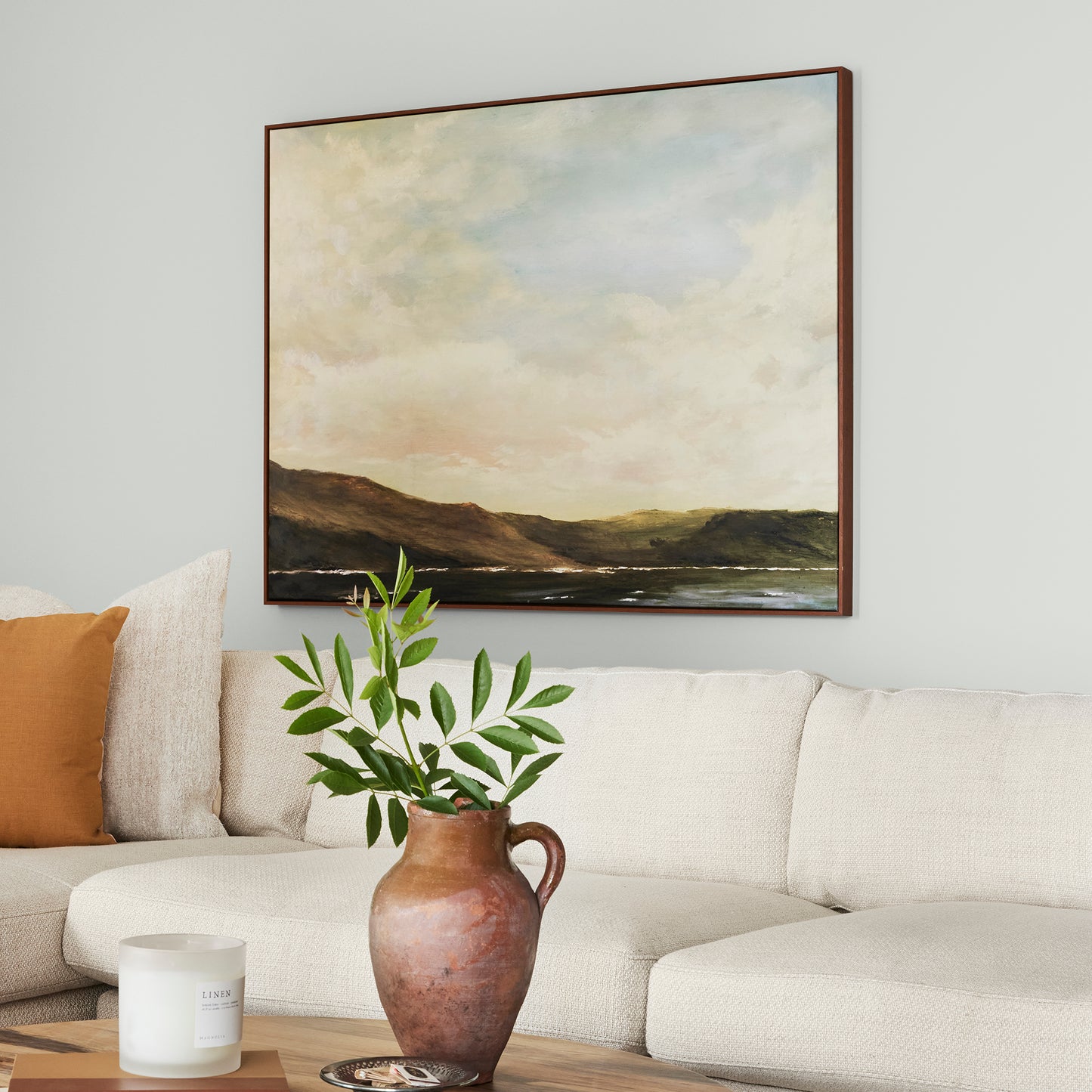 Almost white blended with gray tones interior paint named cloudy gray shown painted on living room wall