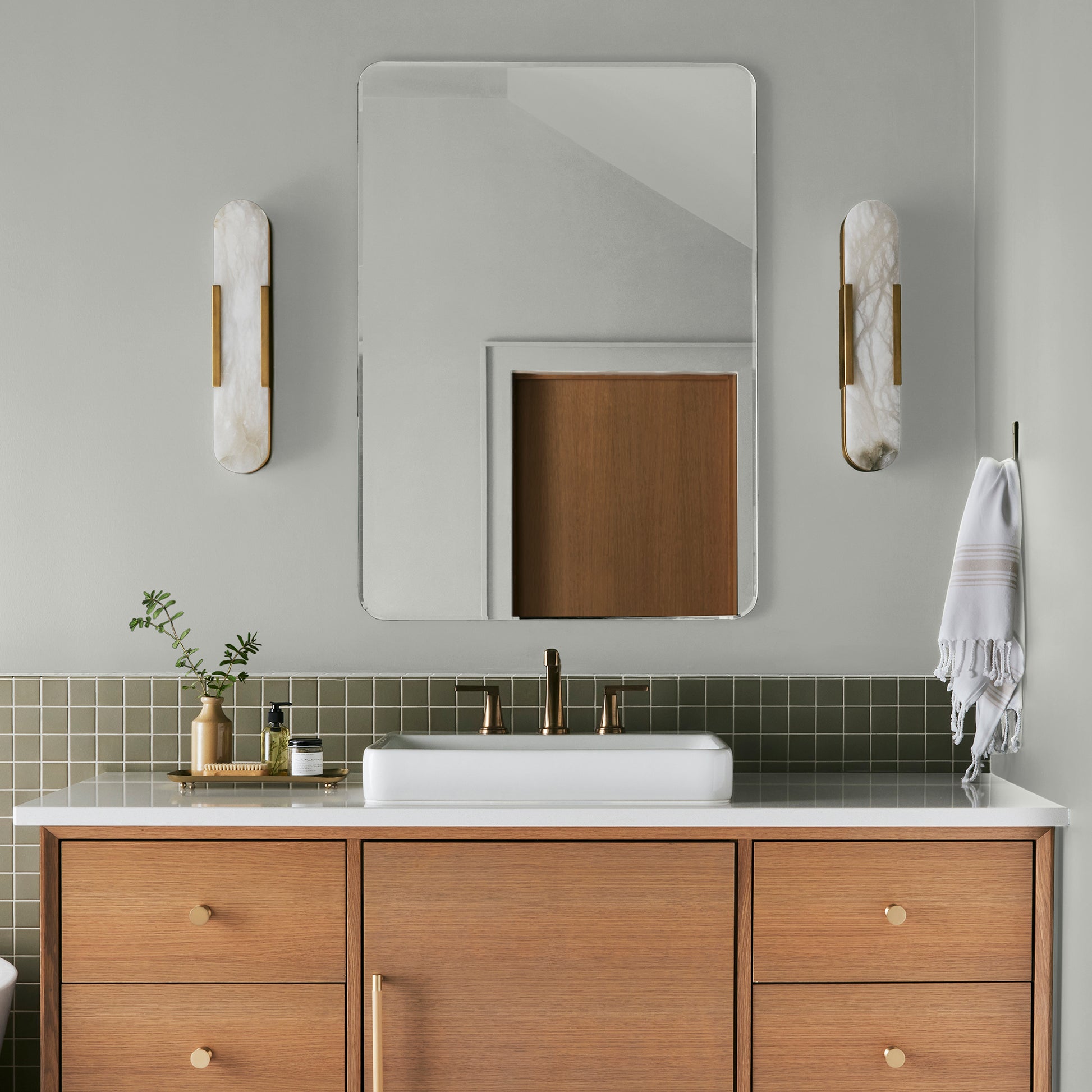 Almost white with gray and green undertones interior paint named chime gray shown painted on bathroom wall