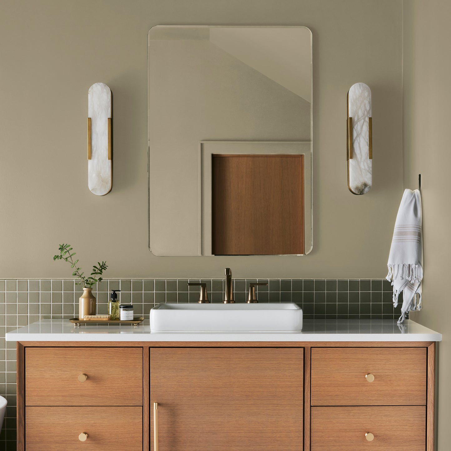 Light green yellow interior paint named sour apple shown painted on bathroom wall