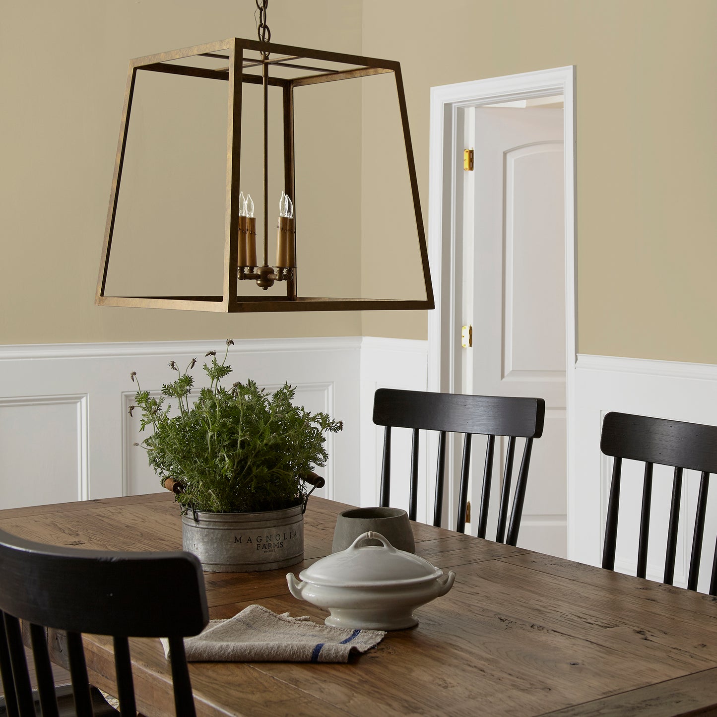 Light green yellow interior paint named sour apple shown painted on dining room wall