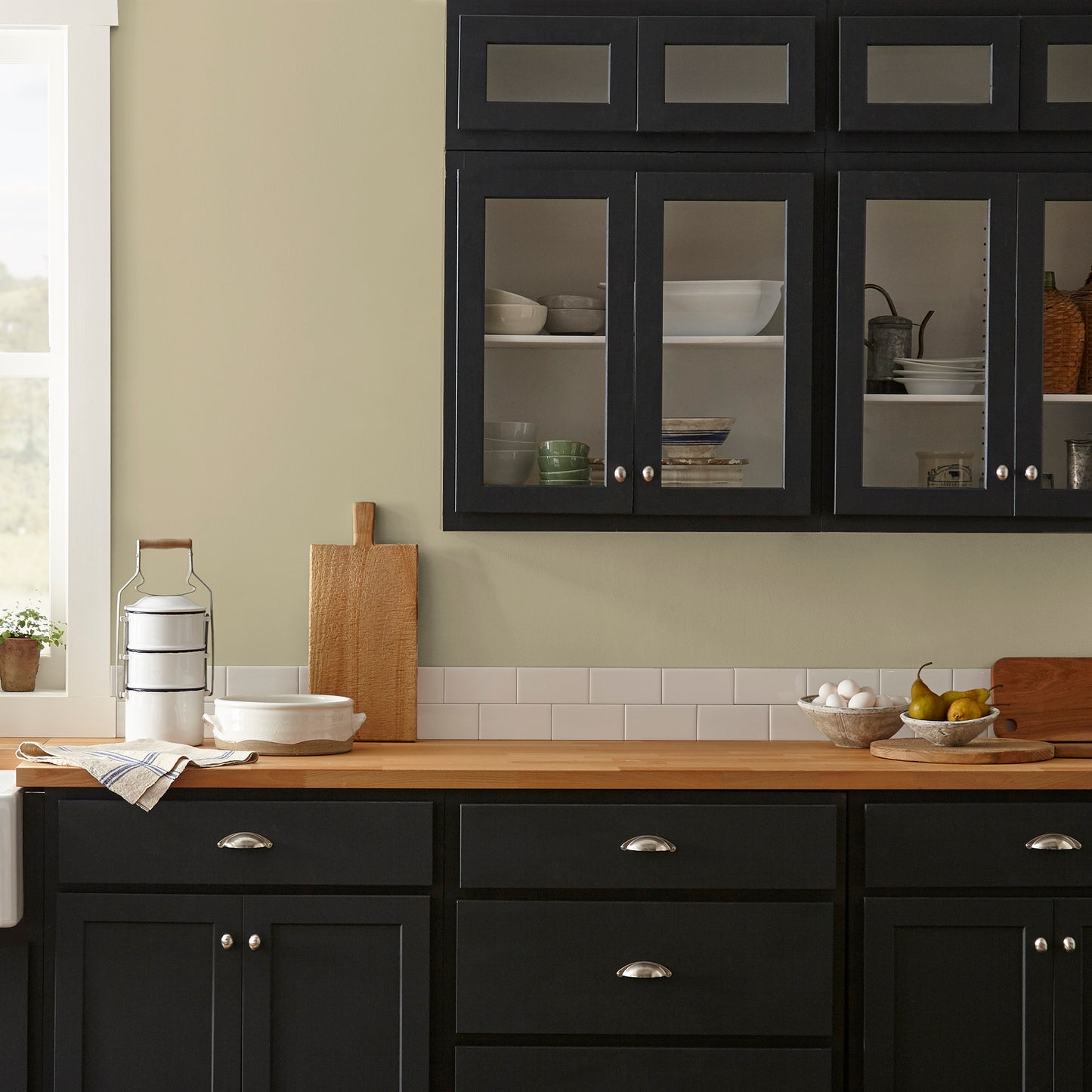 Light green yellow interior paint named sour apple shown painted on kitchen wall