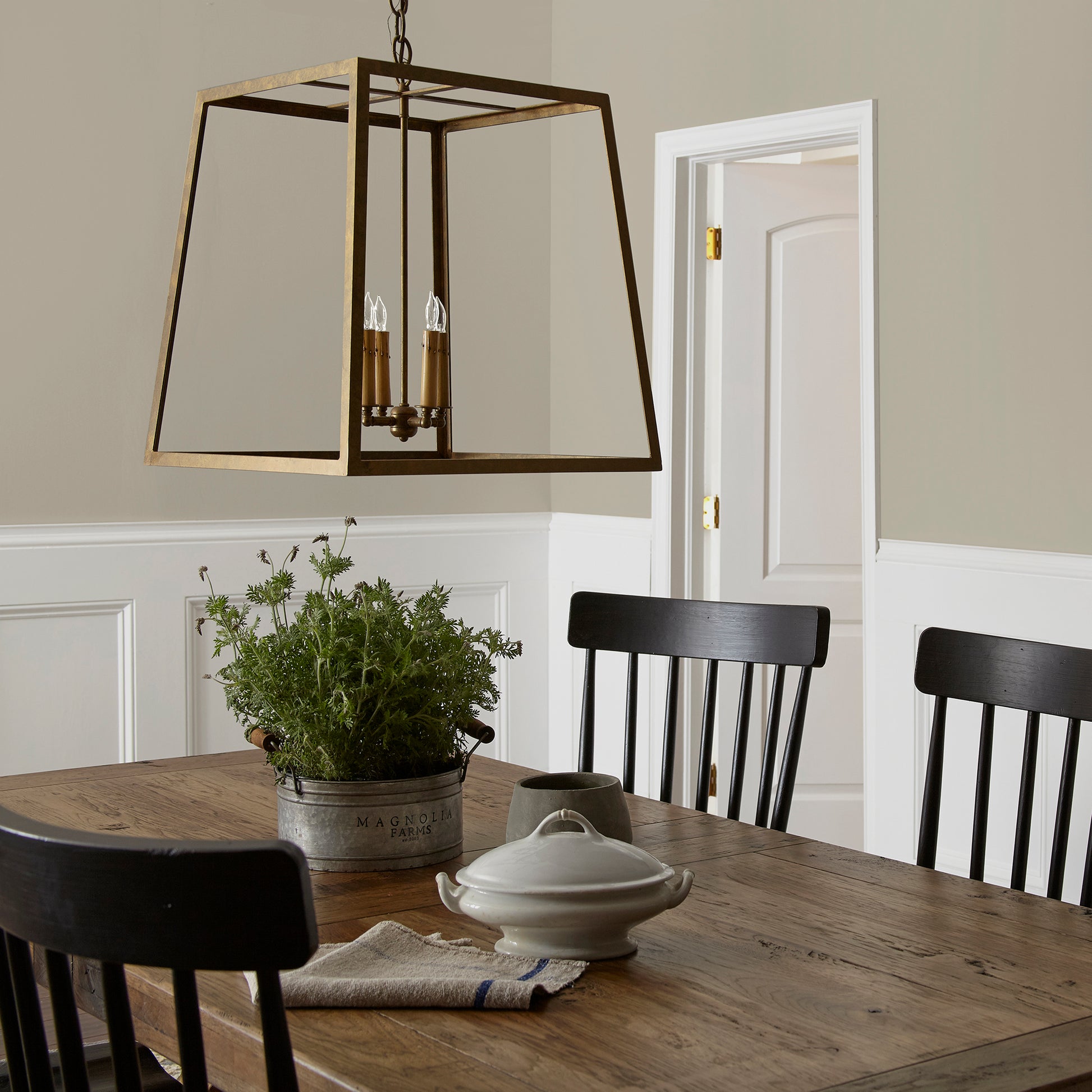Muted apple green with gray accents interior paint named seasonal shown painted on dining room wall