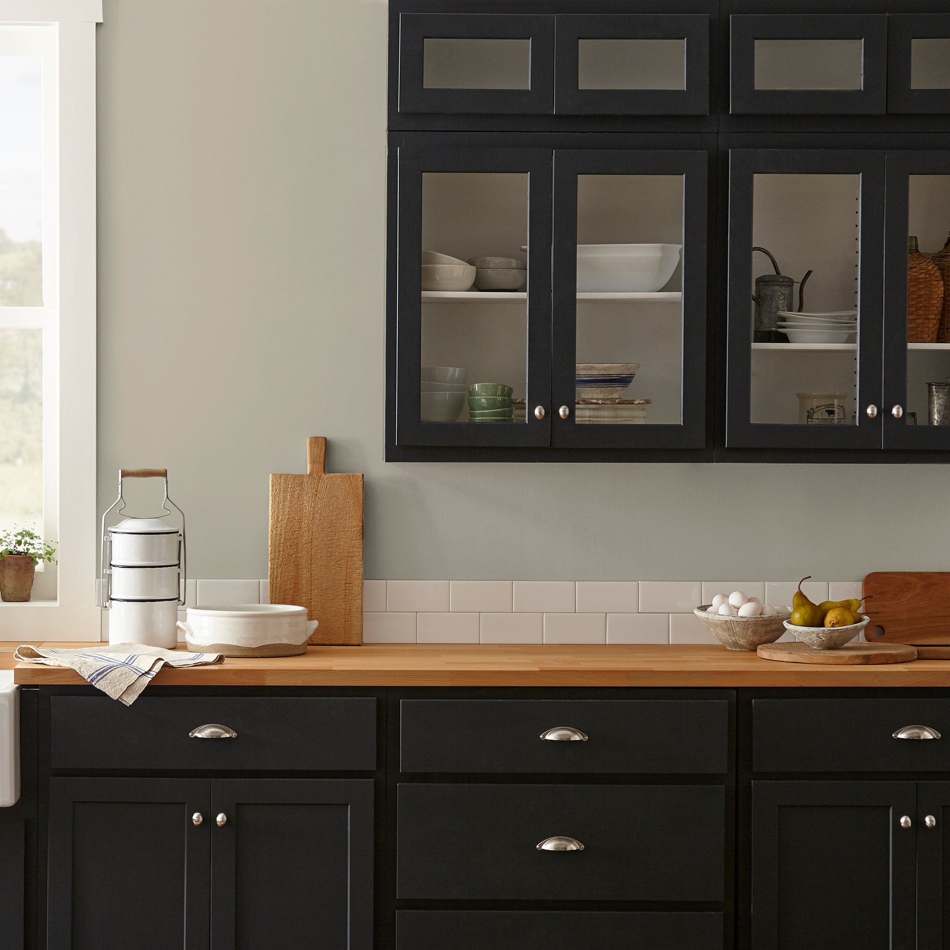 Muted apple green with gray accents interior paint named seasonal shown painted on kitchen wall