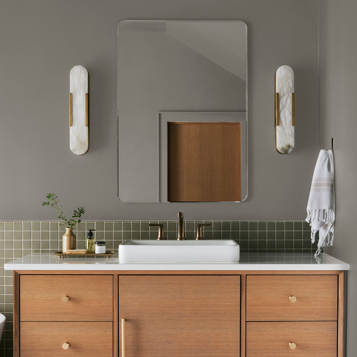 Muted smoky brown interior paint named reclaimed wood shown painted on bathroom wall