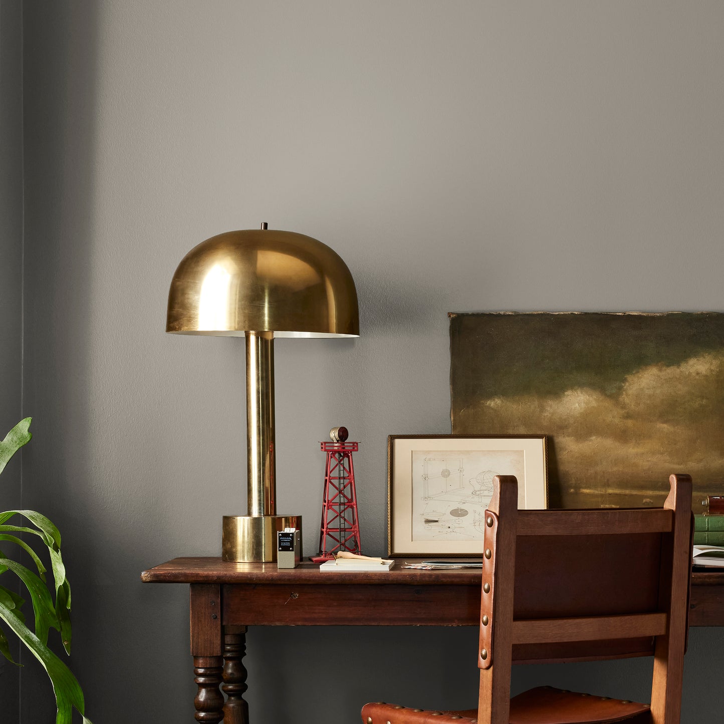 Muted smoky brown interior paint named reclaimed wood shown painted on bedroom wall