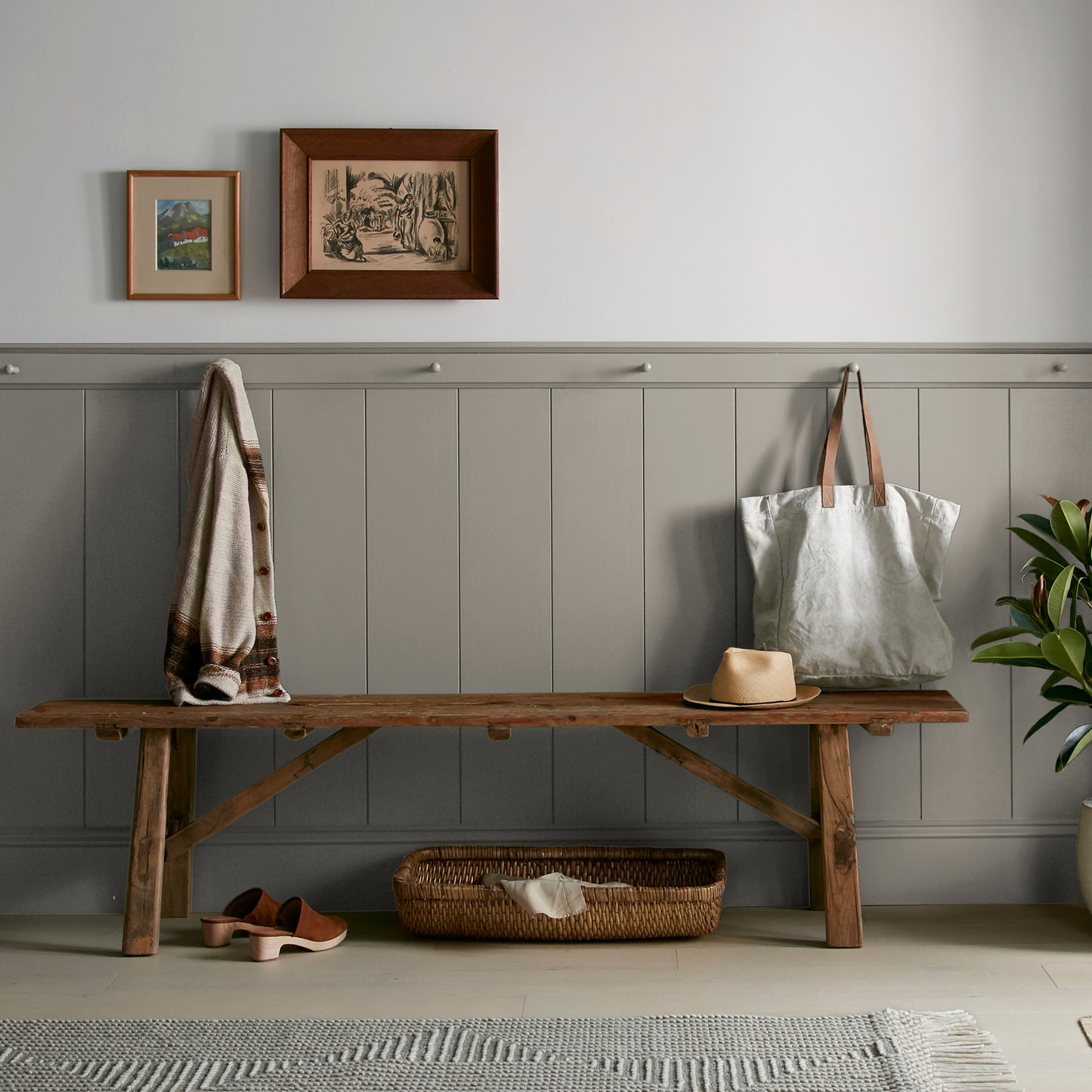Muted smoky brown interior paint named reclaimed wood shown painted on entryway wall