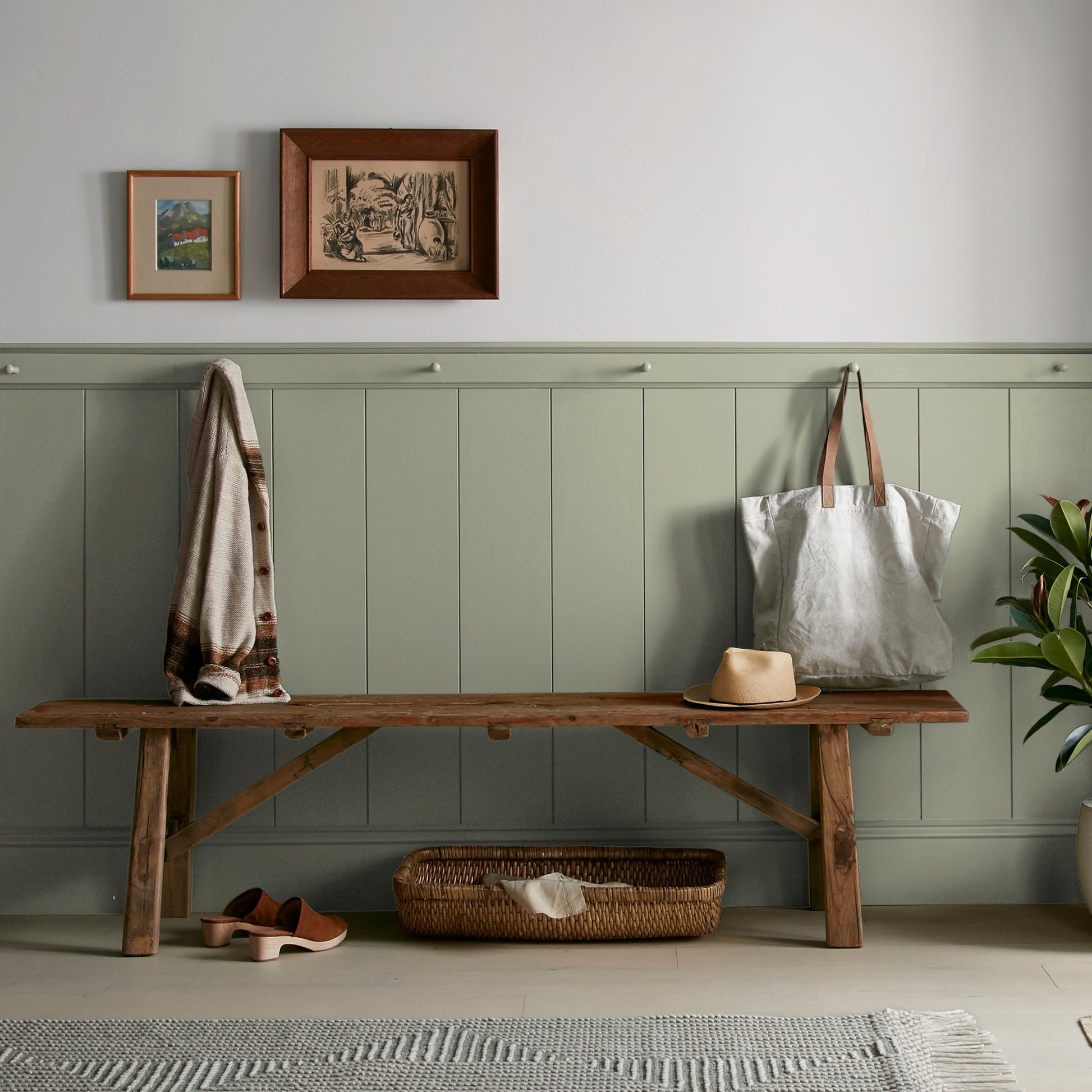 dark grey-green interior paint named garden essential shown painted on entryway wall