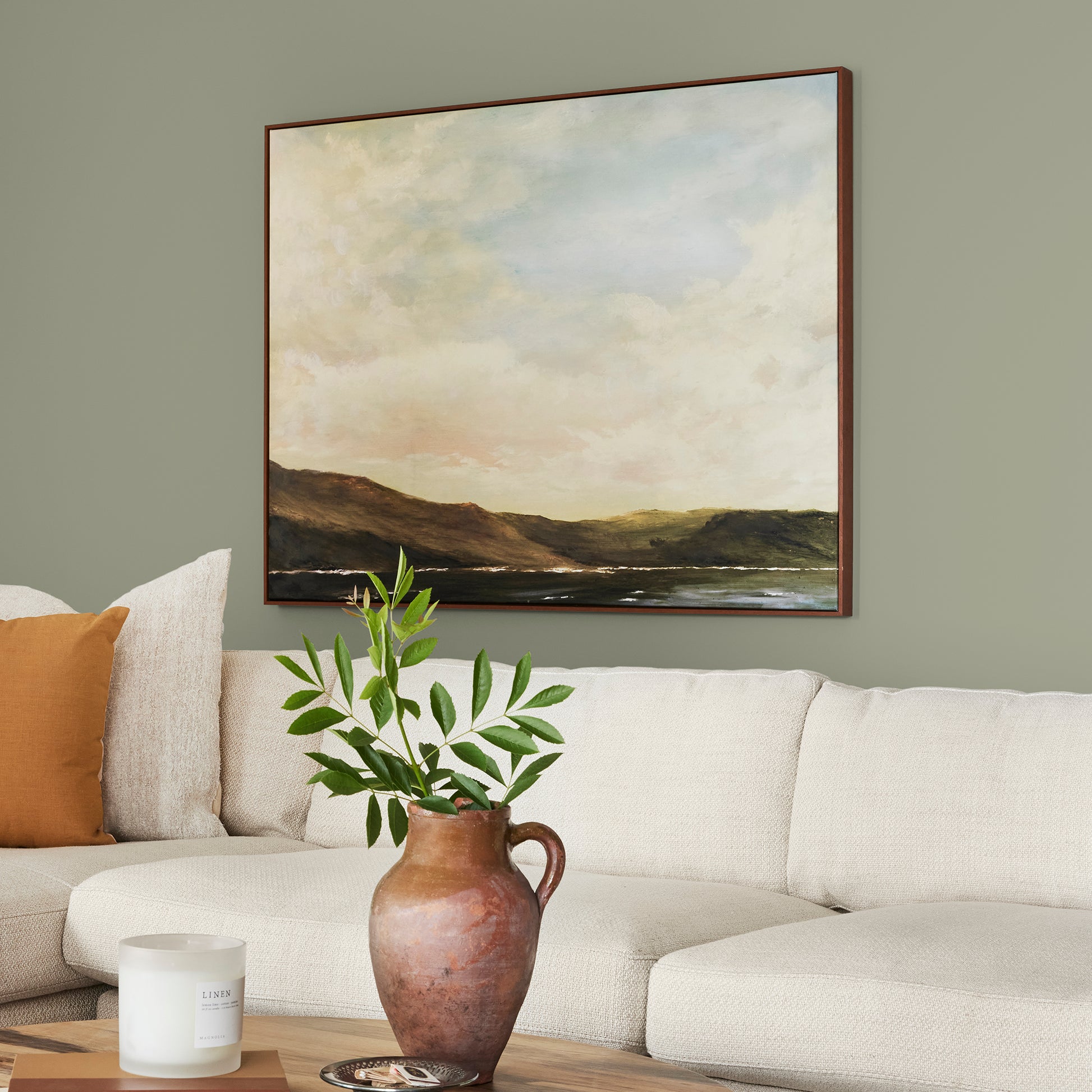 dark grey-green interior paint named garden essential shown painted on living room wall