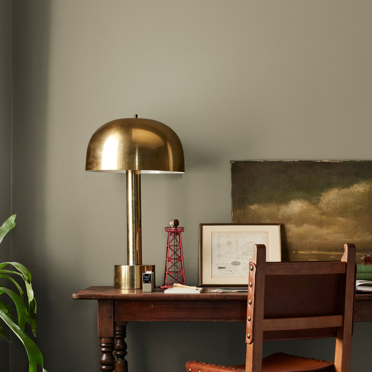 Ashy olive green interior paint named countryside shown painted on bedroom wall