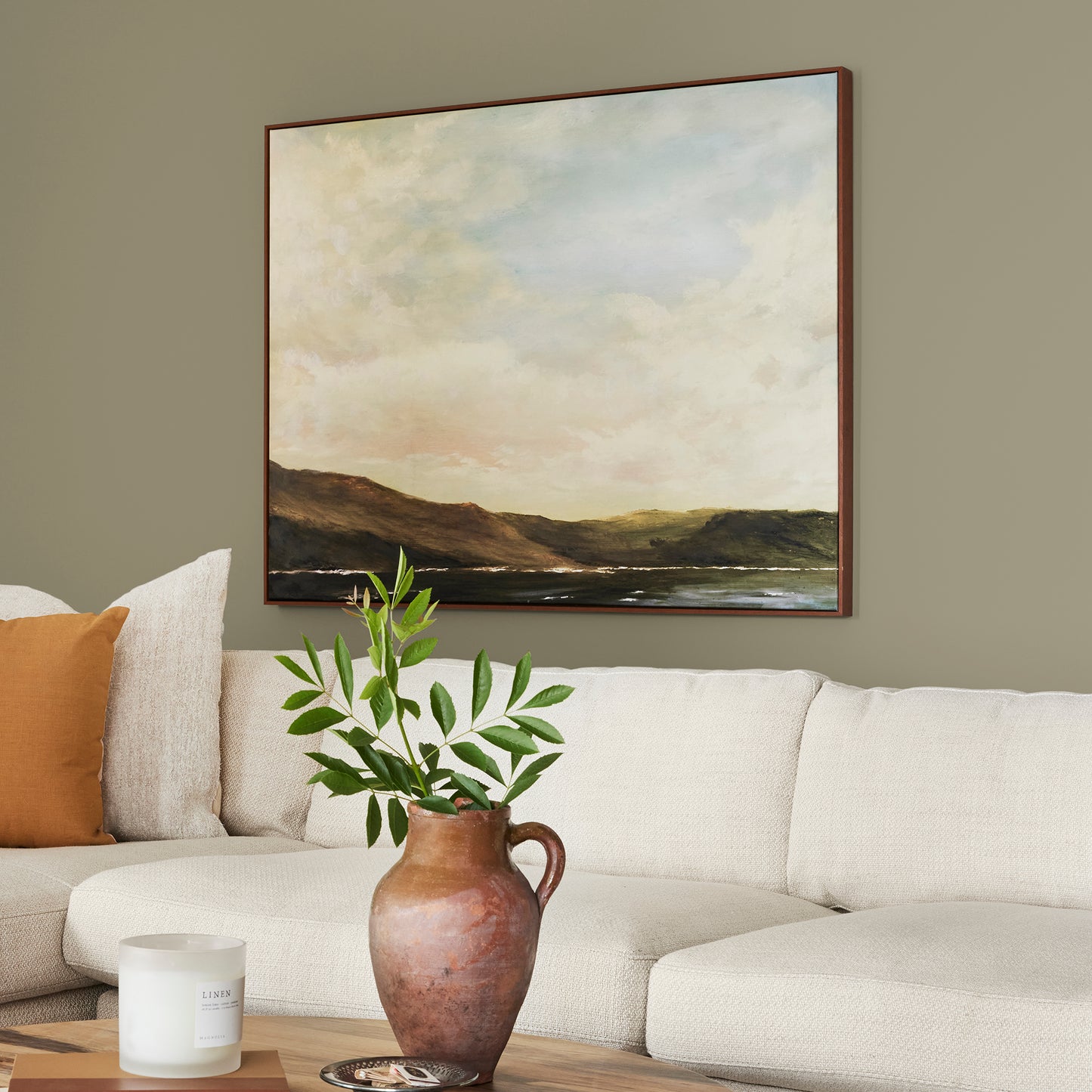 Ashy olive green interior paint named countryside shown painted on living room wall