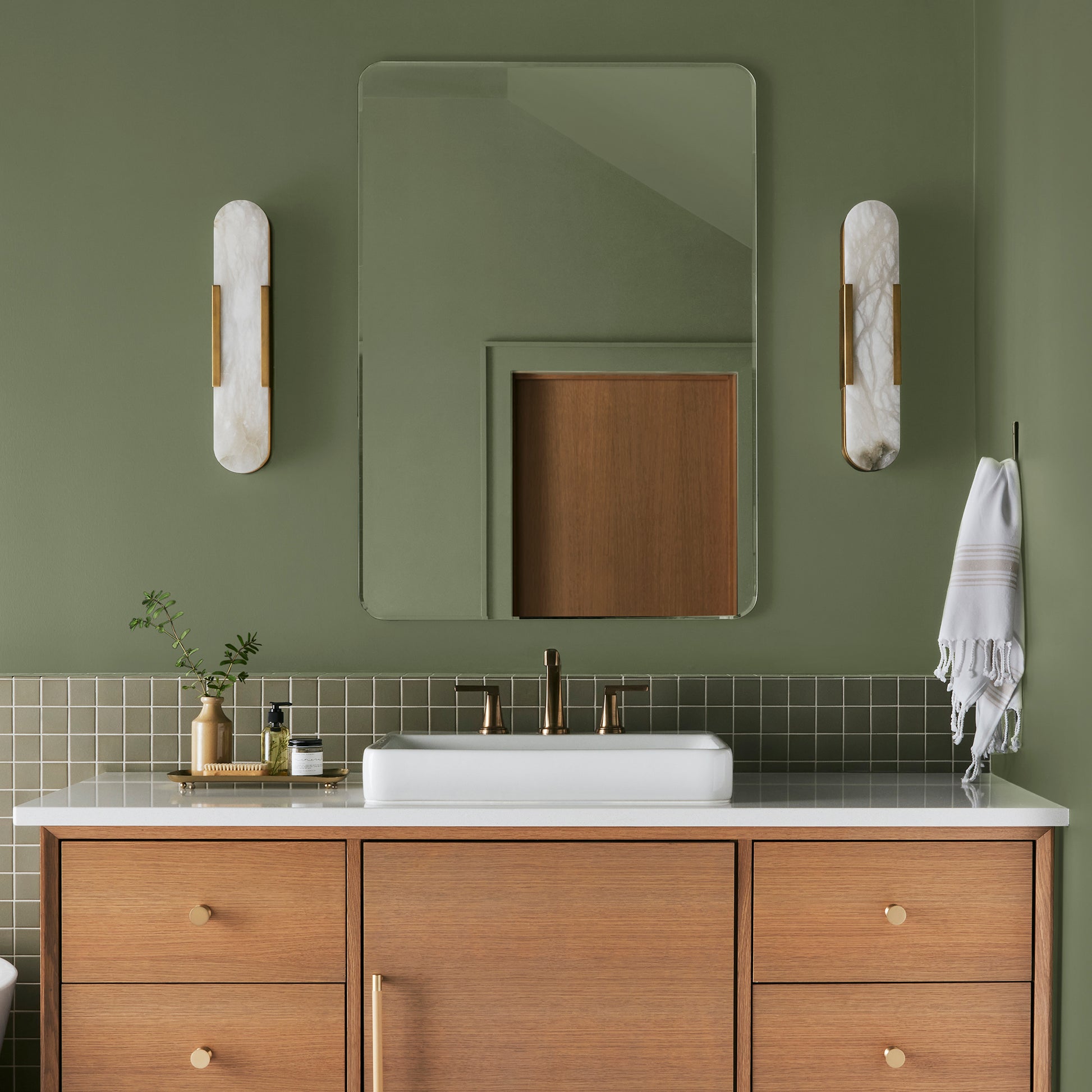 medium avocado green interior paint named celery seed shown painted on bathroom wall