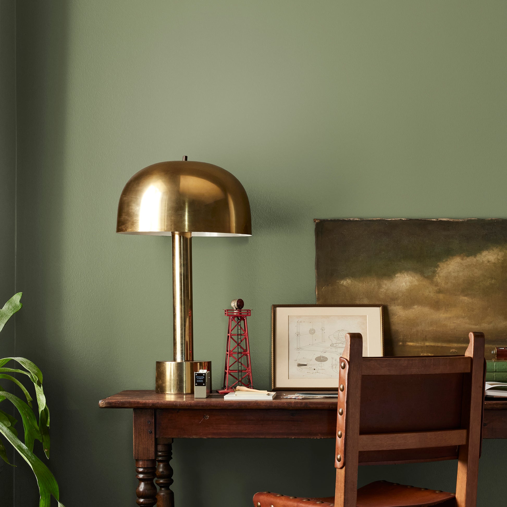 medium avocado green interior paint named celery seed shown painted on bedroom wall