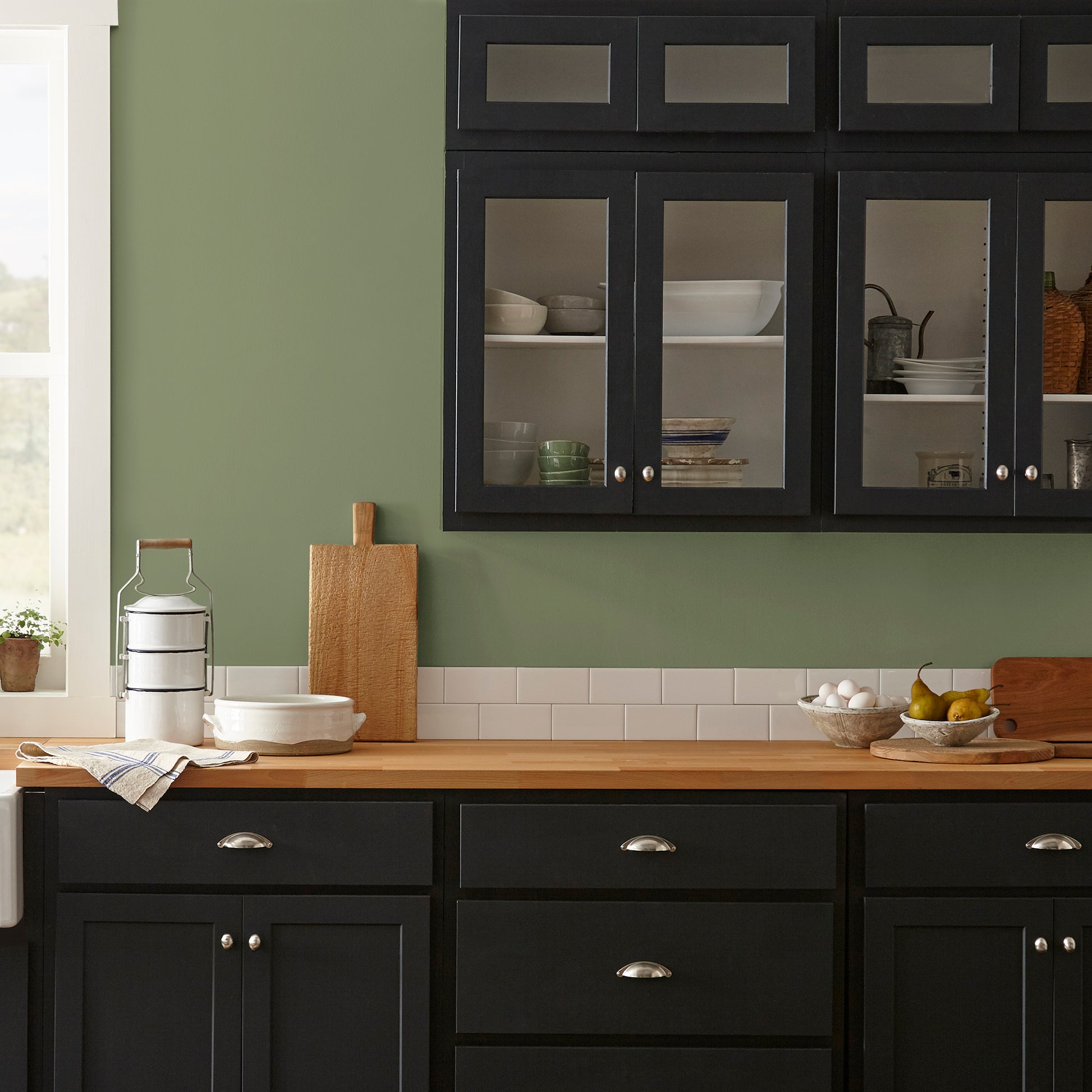 medium avocado green interior paint named celery seed shown painted on kitchen wall