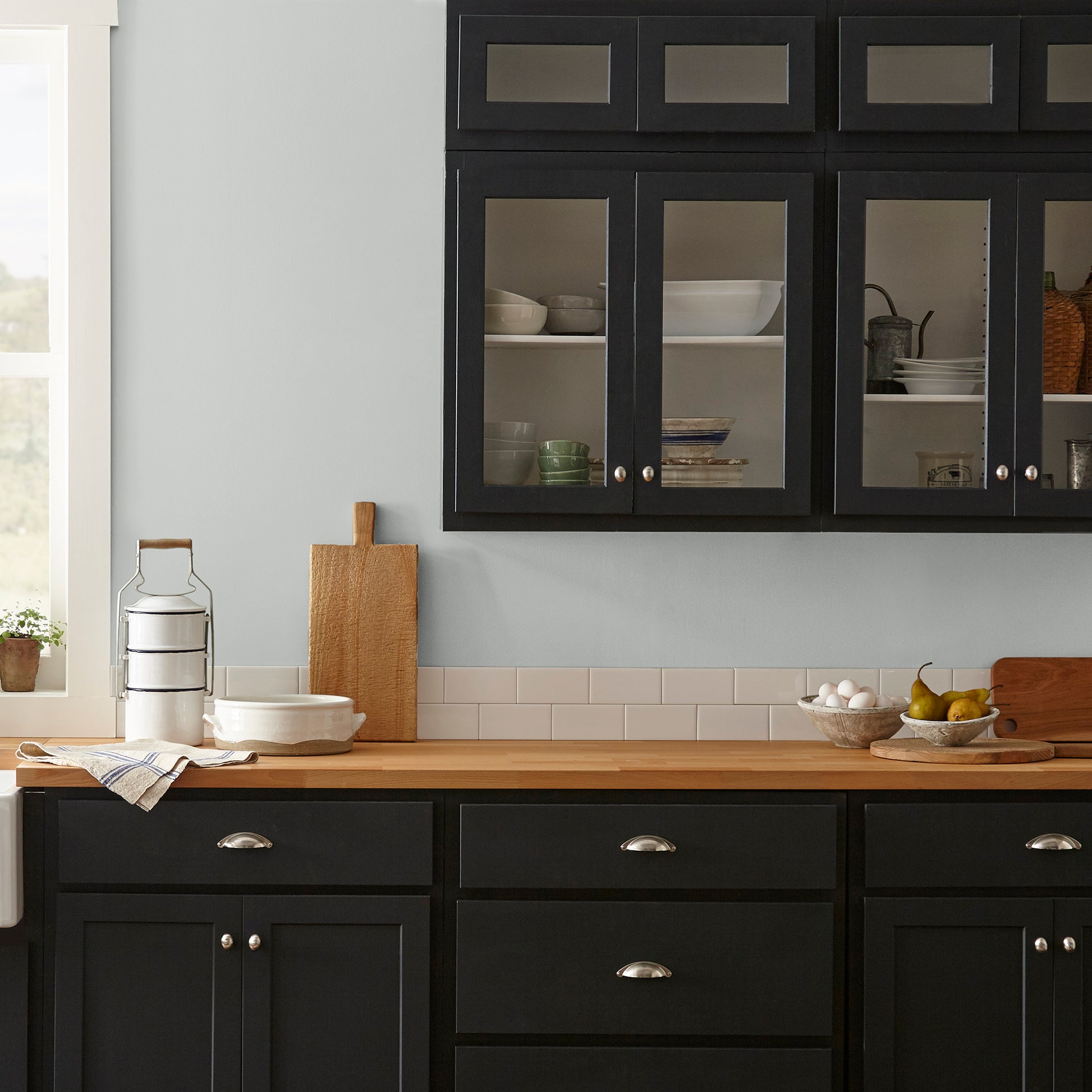 light grey-blue paint named dark moon shown painted on kitchen wall