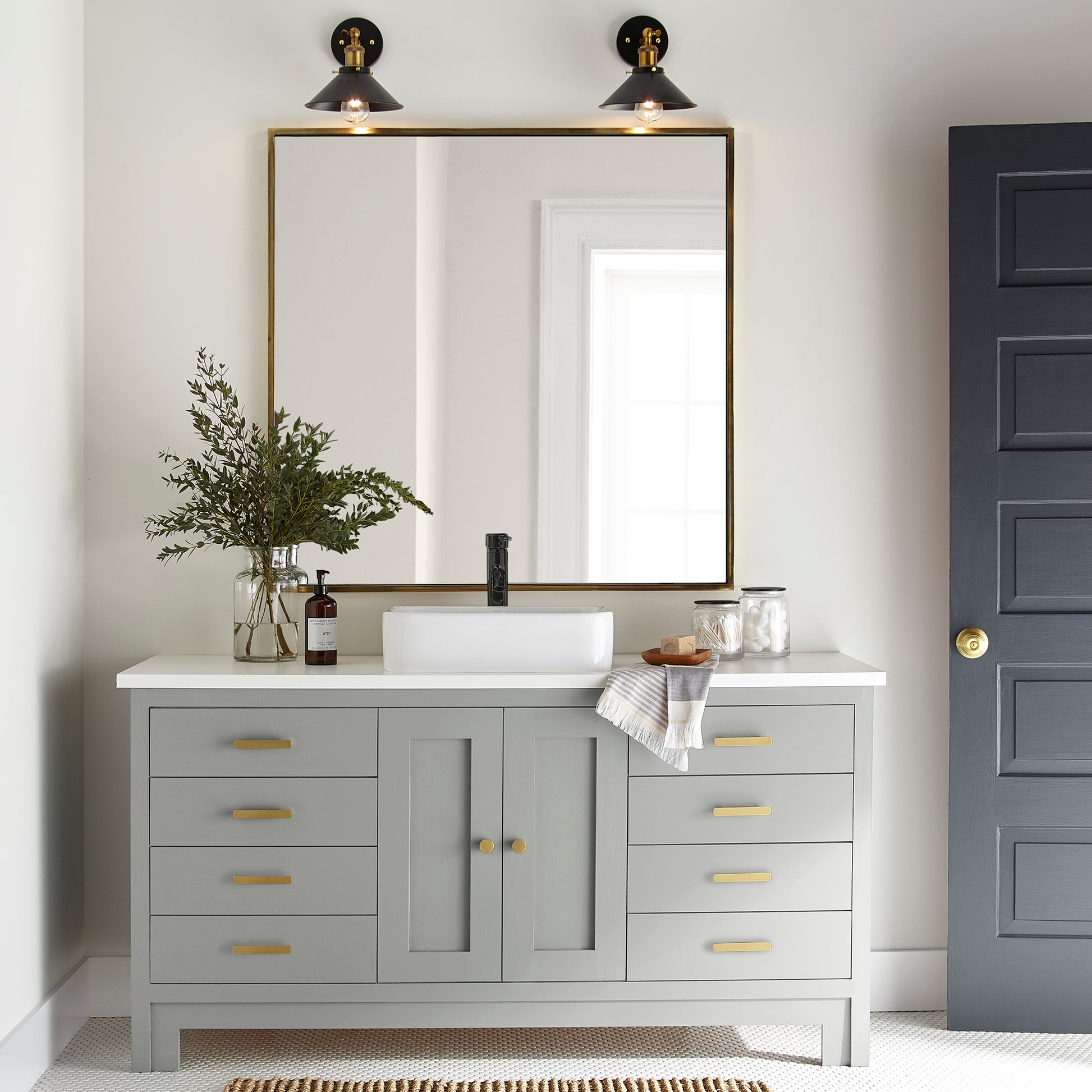 Light mid-tone gray door and cabinet paint named day-to-day shown painted on bathroom cabinet