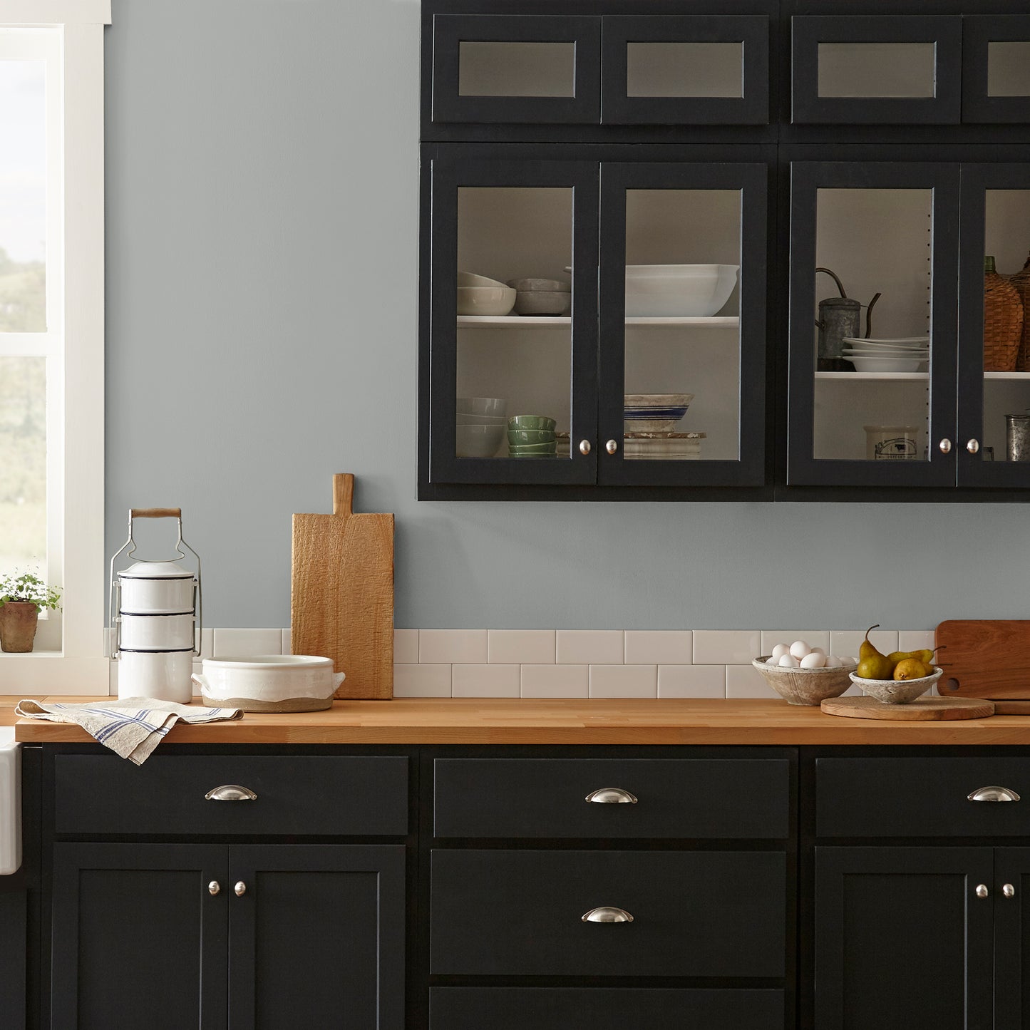 warm charcoal grey interior paint named vintage weathervane shown painted on kitchen wall