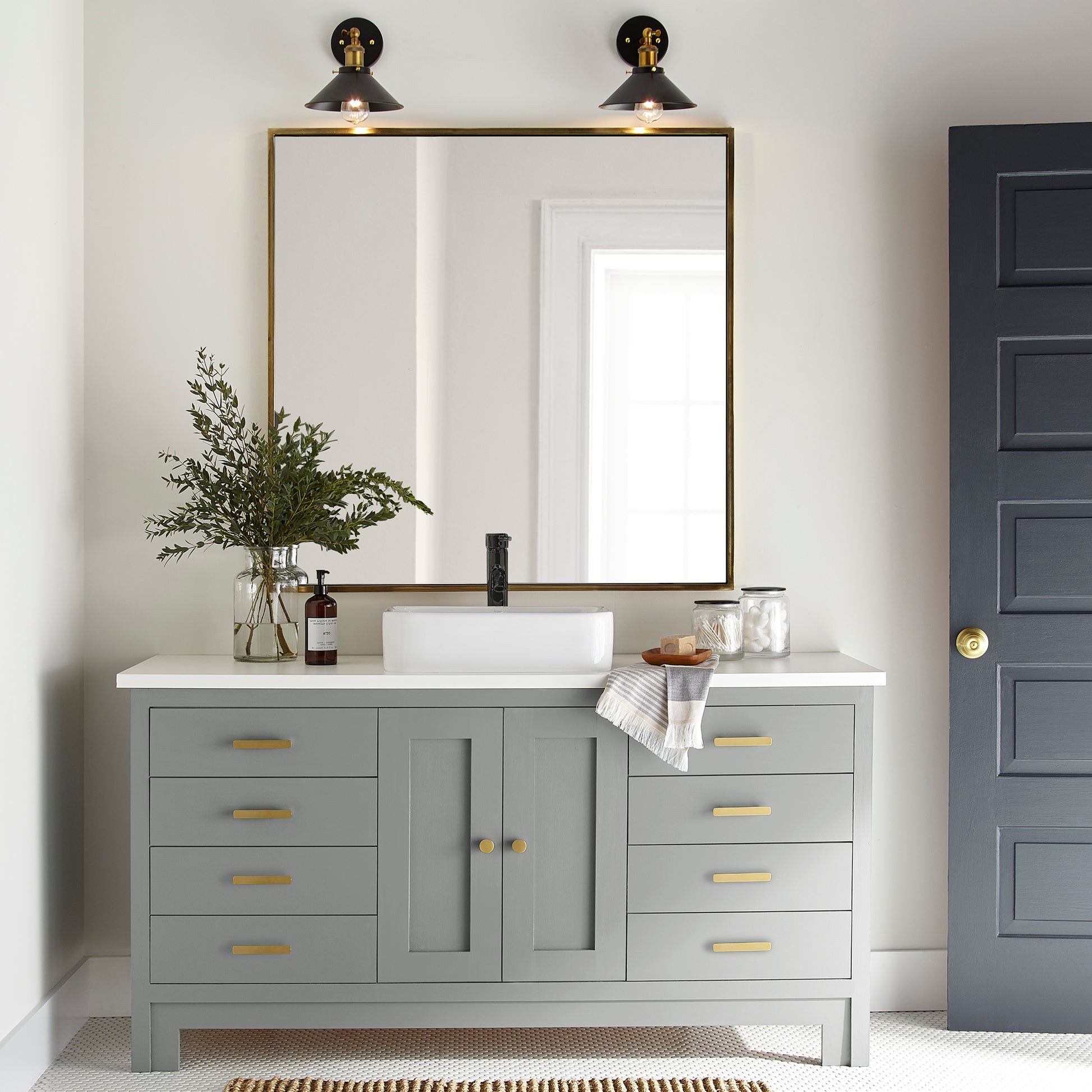 Warm charcoal gray door and cabinet paint named vintage weathervane shown painted on bathroom cabinets