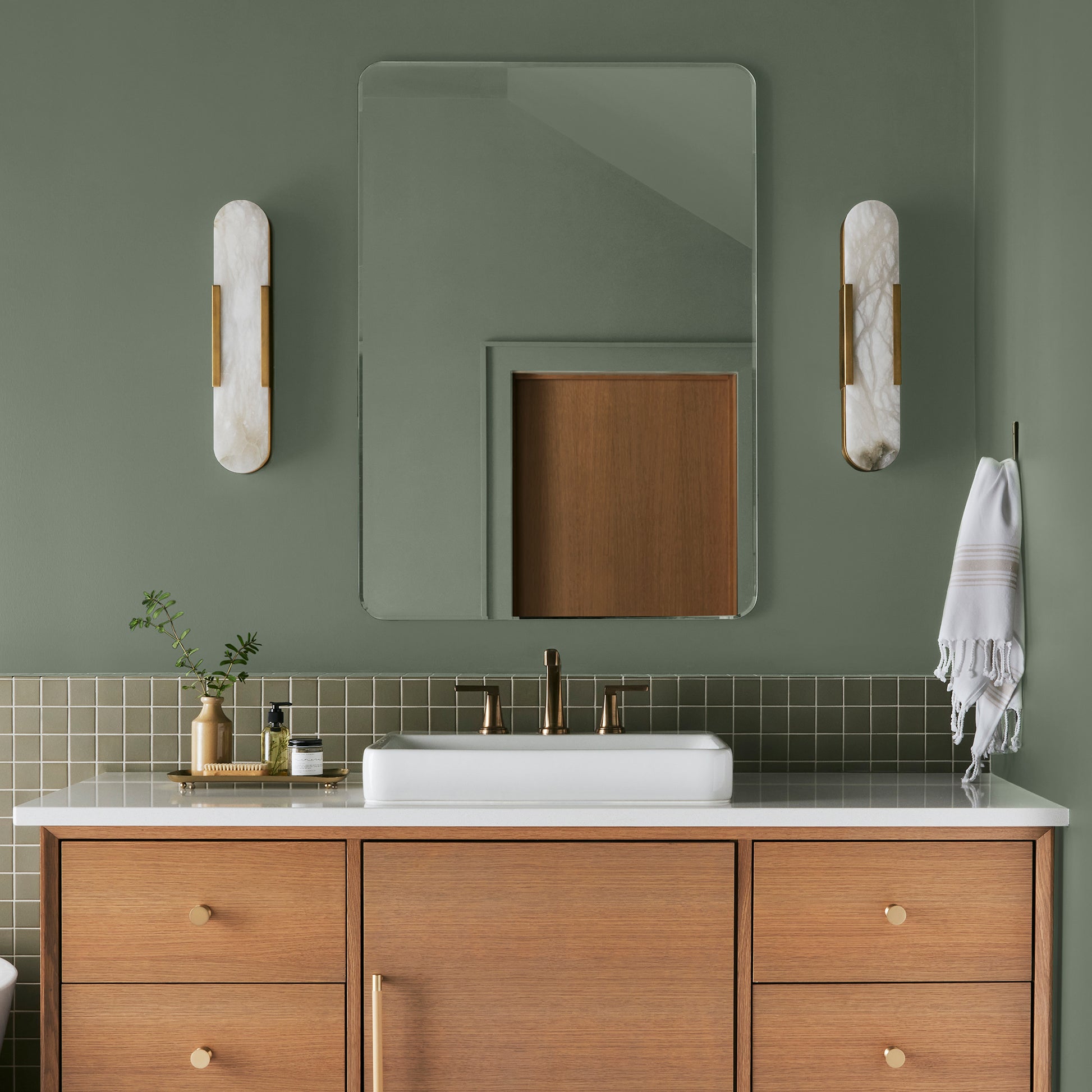 medium olive green paint named olive grove shown painted on bathroom wall