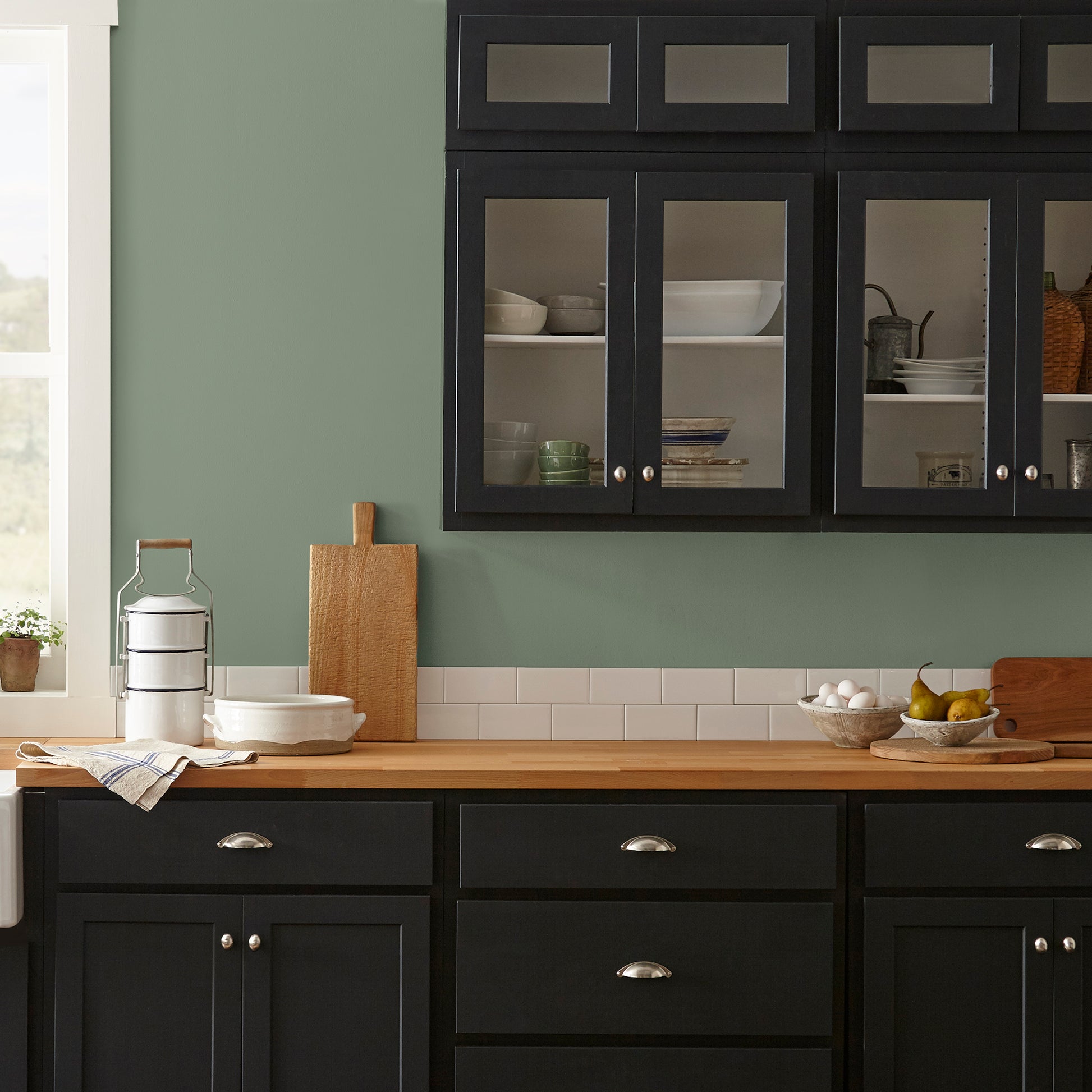 medium olive green paint named olive grove shown painted on kitchen wall