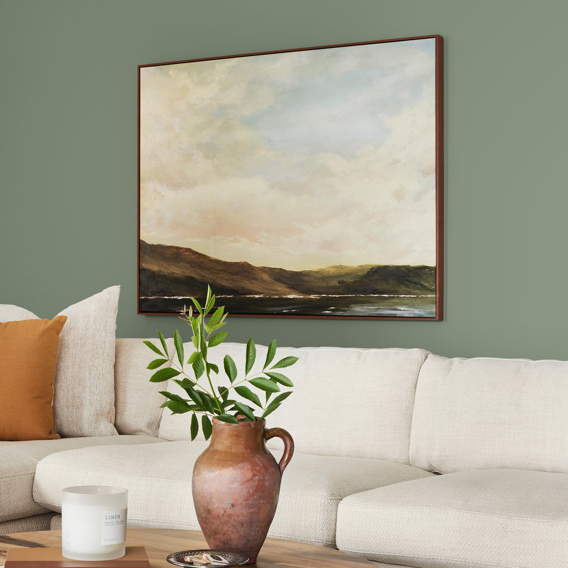 medium olive green paint named olive grove shown painted on living room wall