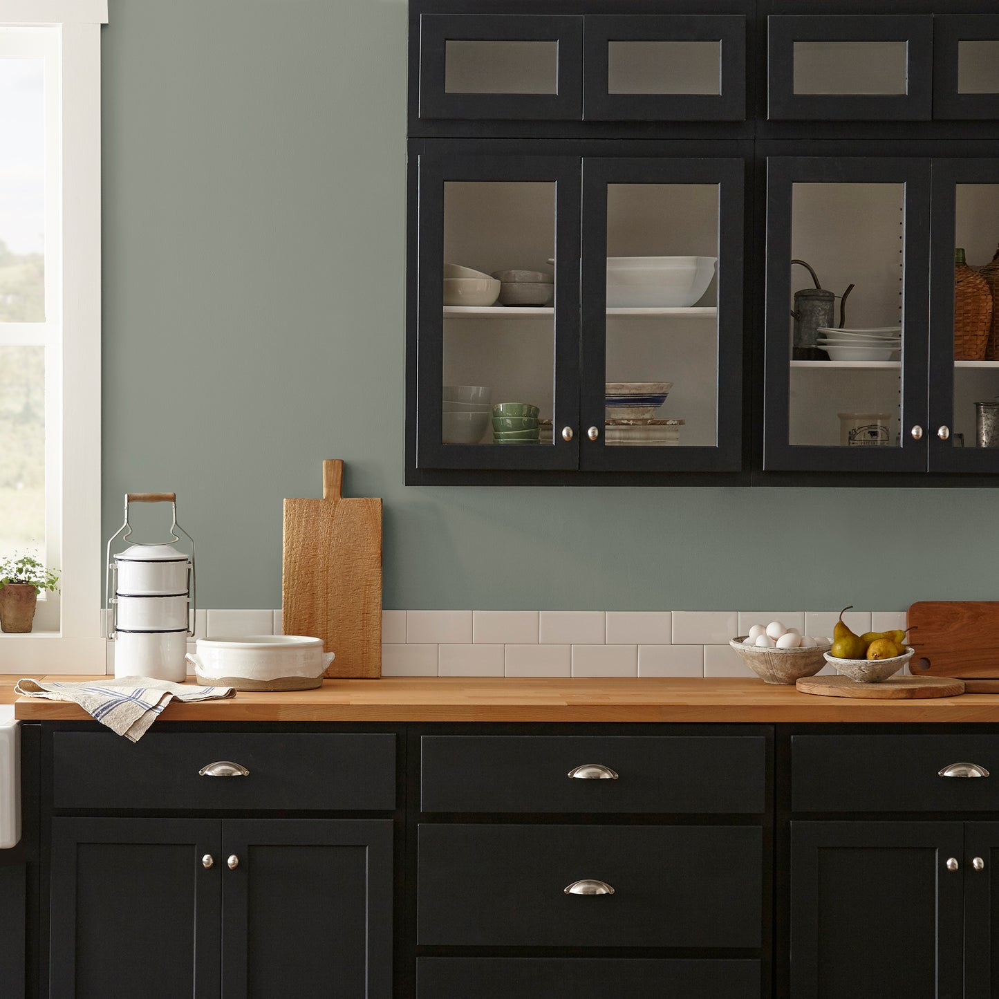 Pale ivy green interior paint named eden shown painted on kitchen wall