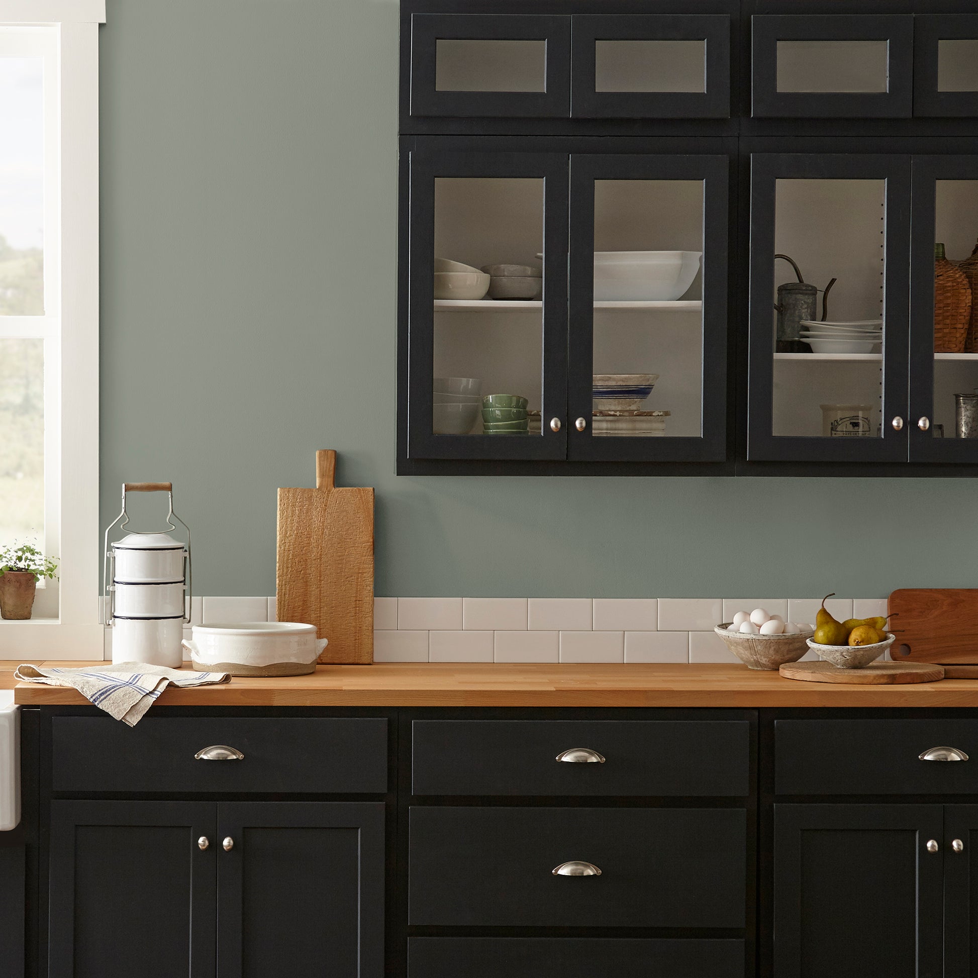 Pale ivy green interior paint named eden shown painted on kitchen wall