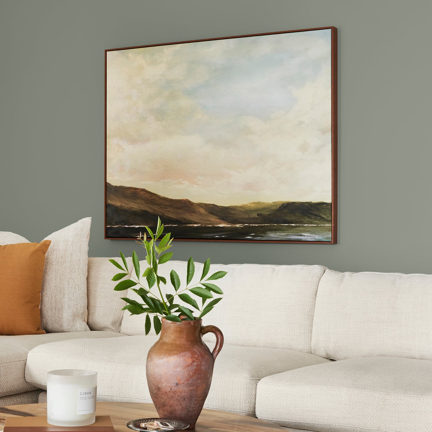 Pale ivy green interior paint named eden shown painted on living room wall