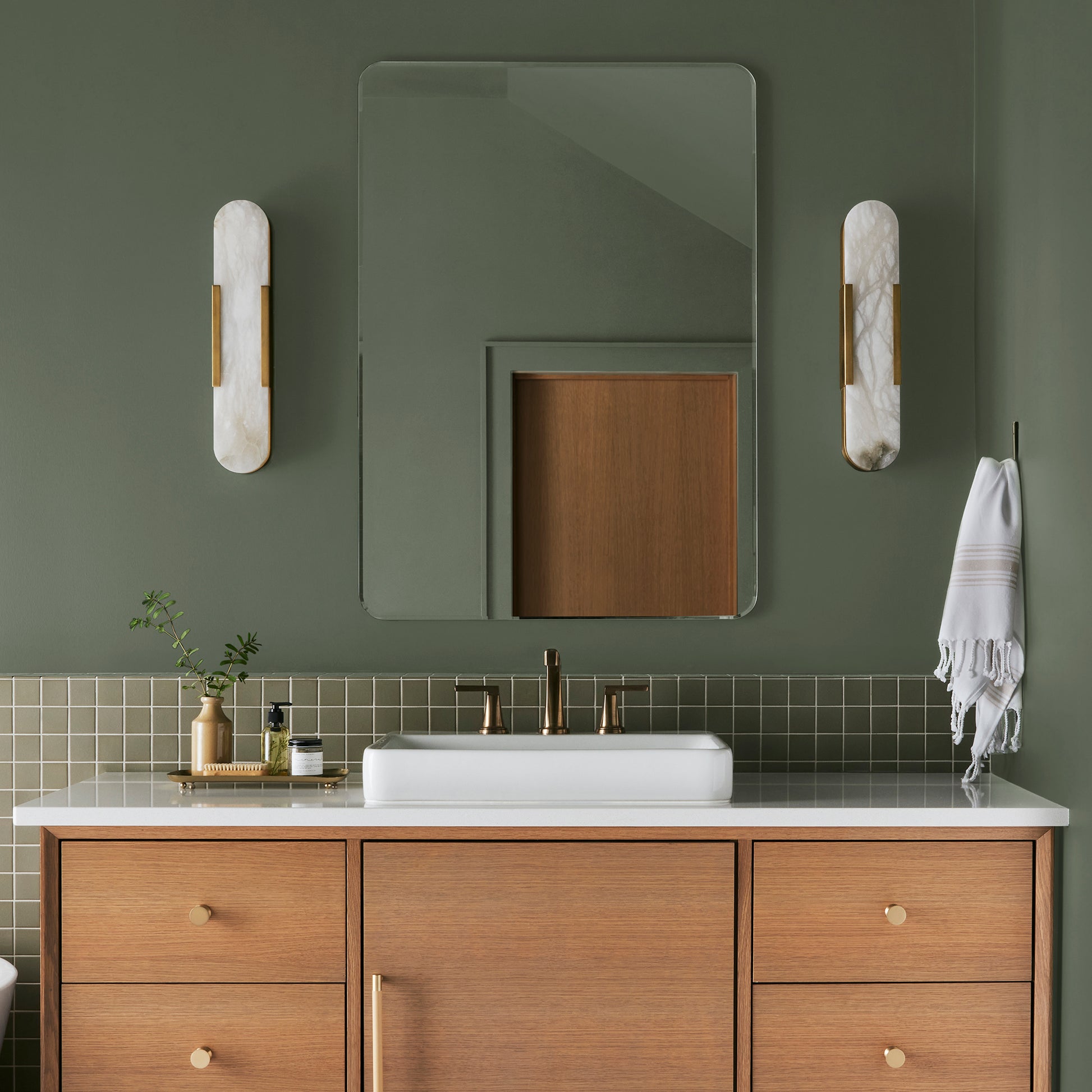 dark sage green paint named lemon leaves shown painted on bathroom wall