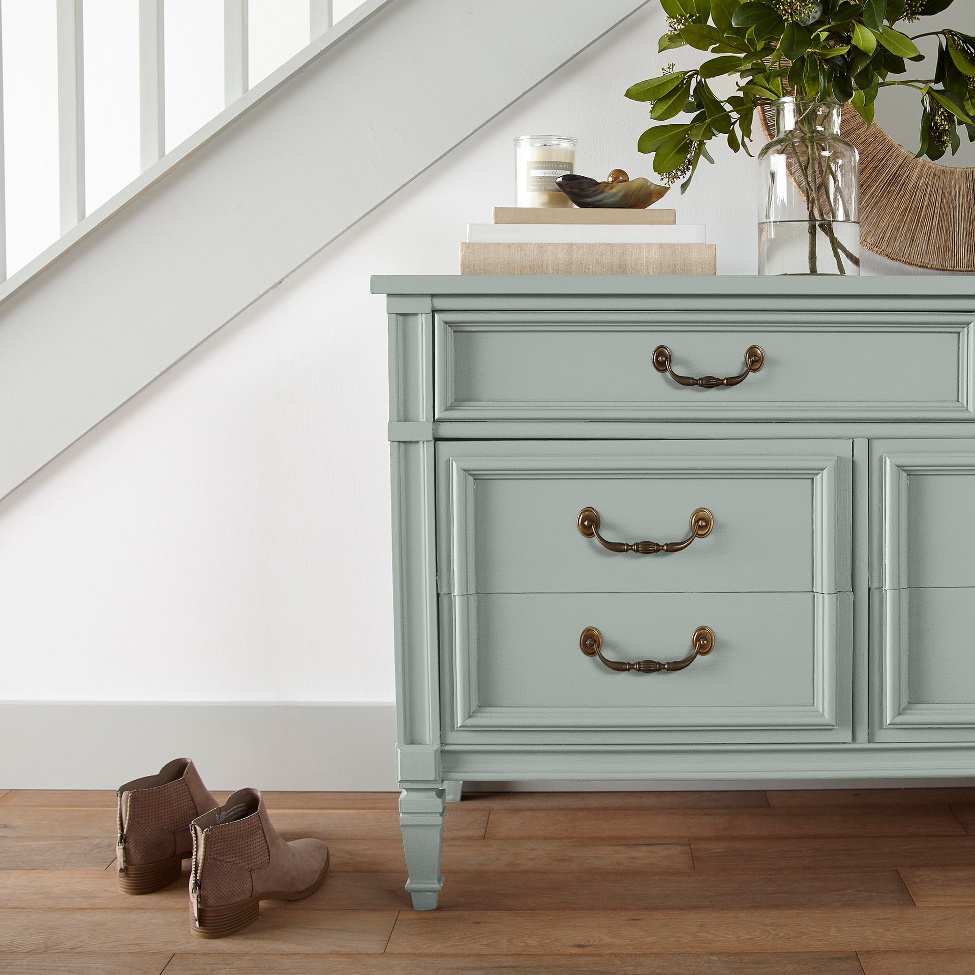 Frosty mint with green and light blue accents door and cabinet paint named mineral green shown painted on entryway cabinet