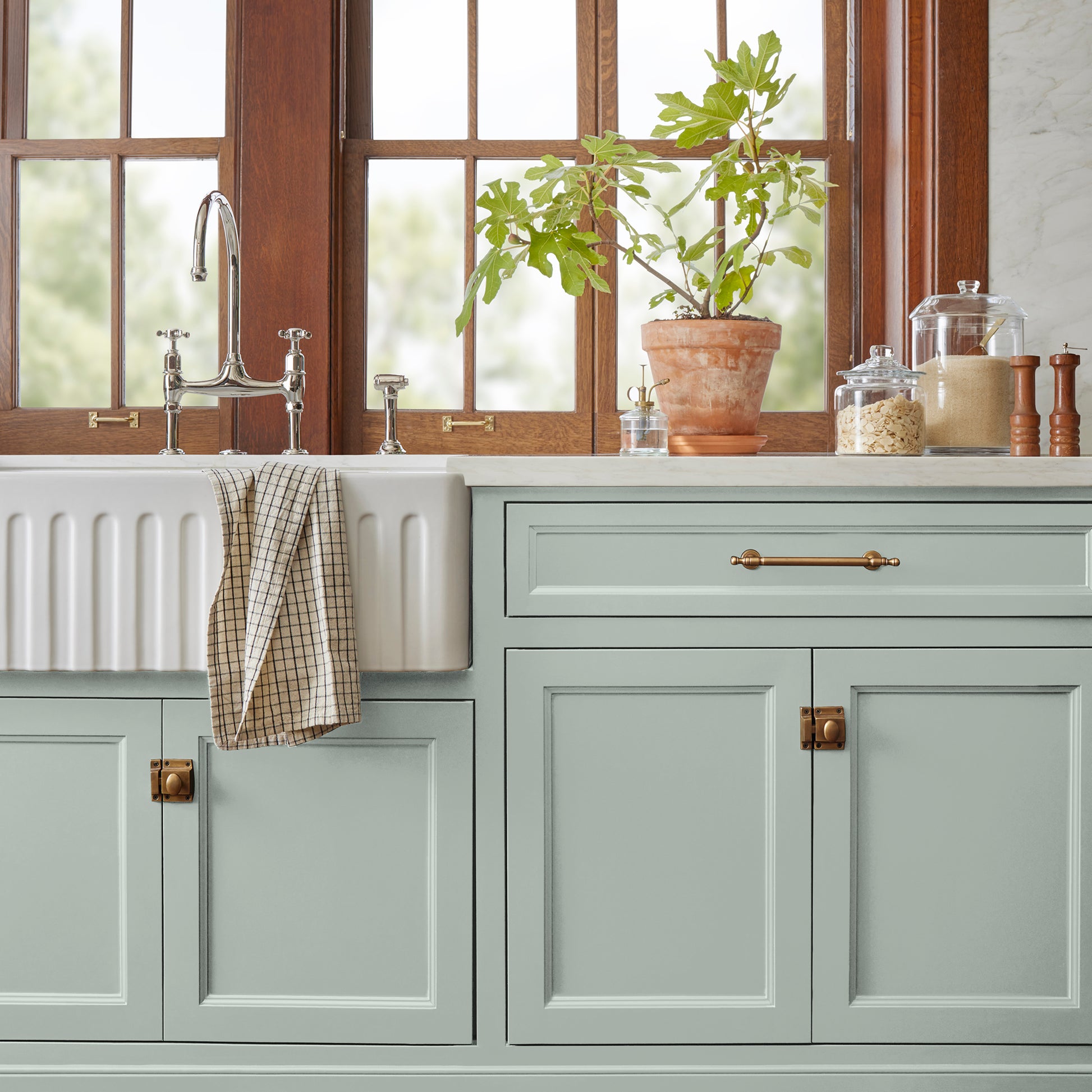 Frosty mint with green and light blue accents door and cabinet paint named mineral green shown painted on kitchen cabinet
