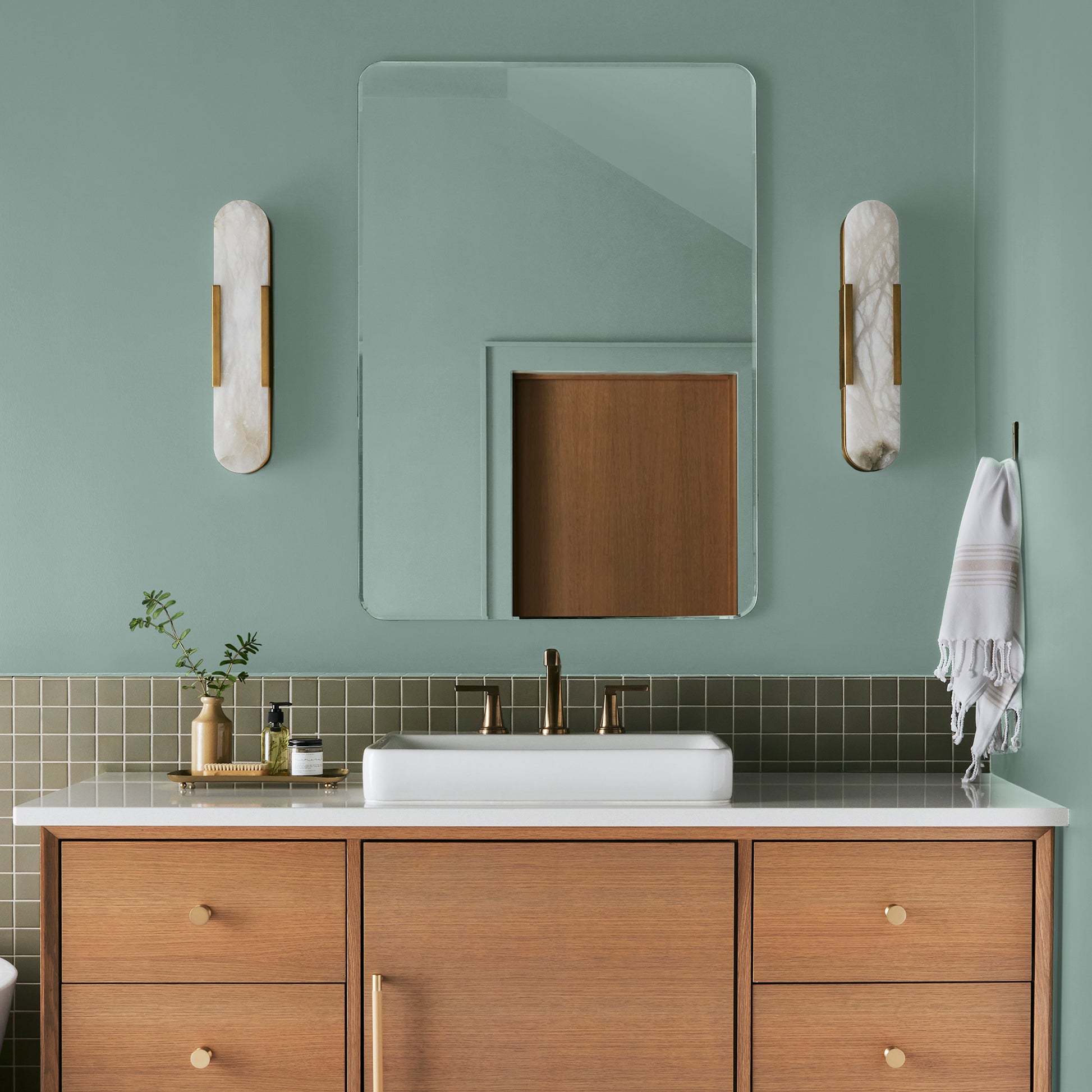 Aqua and minty blue slightly muted with gray interior paint named texas summer shown painted on bathroom wall