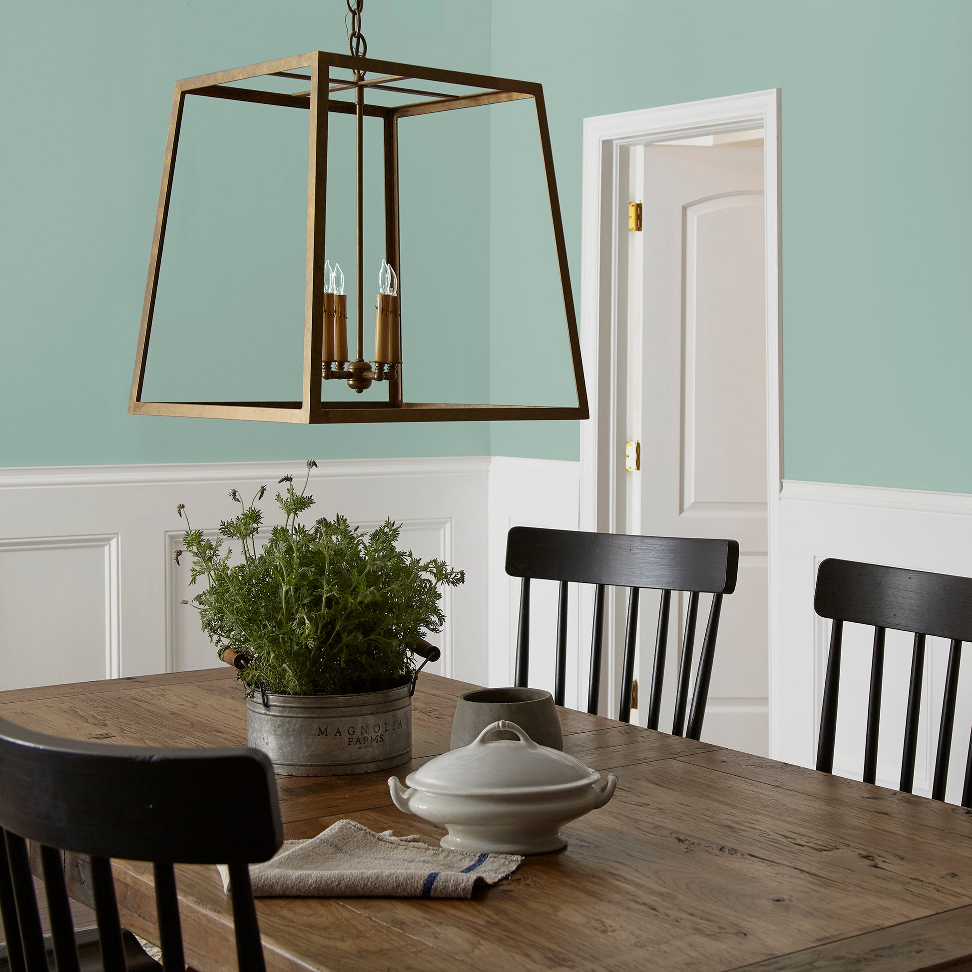 Aqua and minty blue slightly muted with gray interior paint named texas summer shown painted on dining room wall