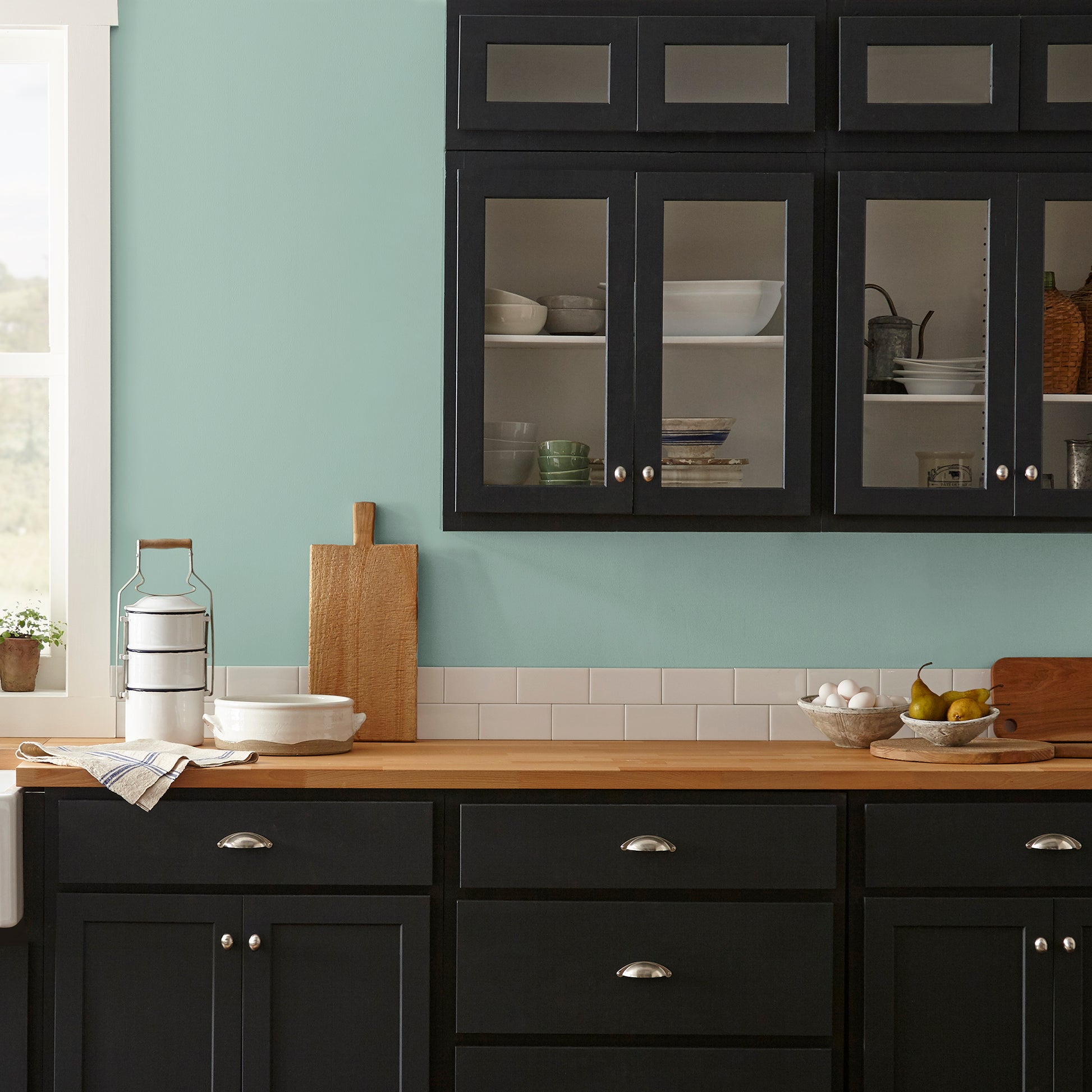 Aqua and minty blue slightly muted with gray interior paint named texas summer shown painted on kitchen wall