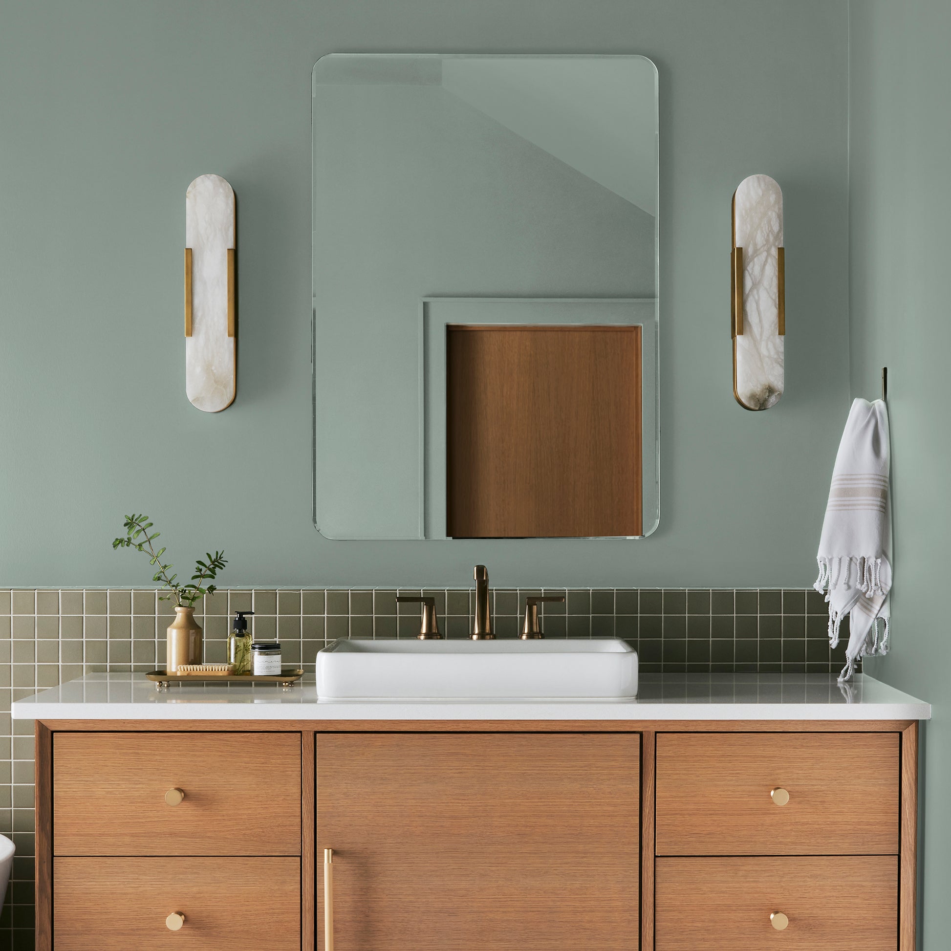 Washed mint green interior paint named local greenhouse shown painted on bathroom wall