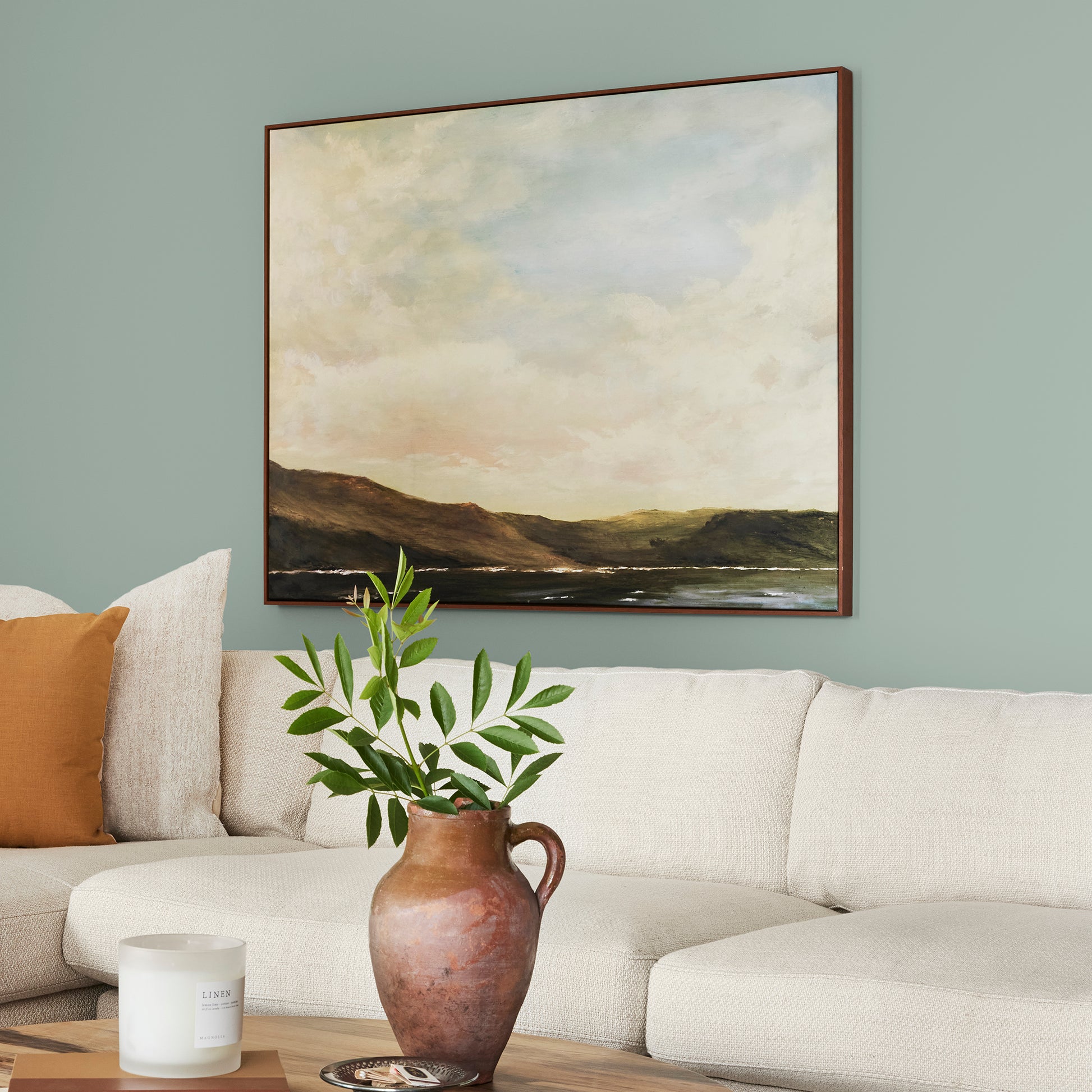 Washed mint green interior paint named local greenhouse shown painted on living room wall