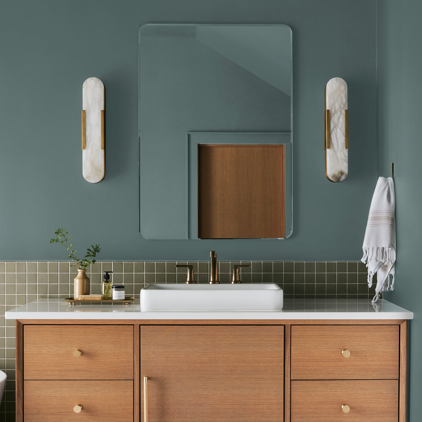 Deep dusty sea green interior paint named demo day shown painted on bathroom wall