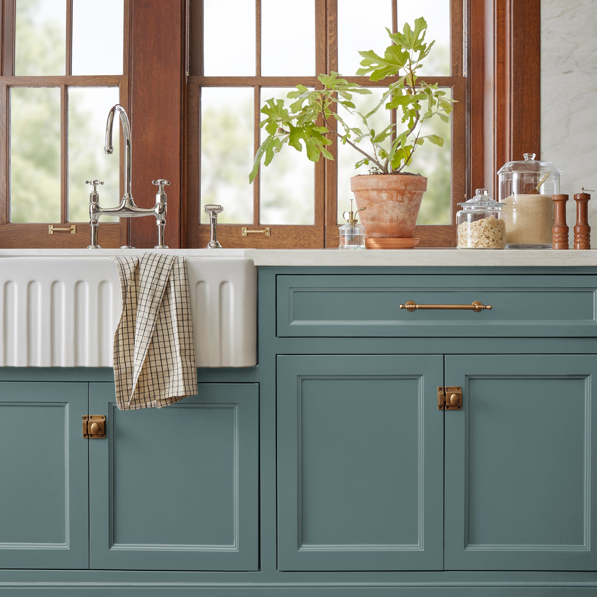 Deep dusty sea green door and cabinet paint named demo day shown painted on kitchen cabinet