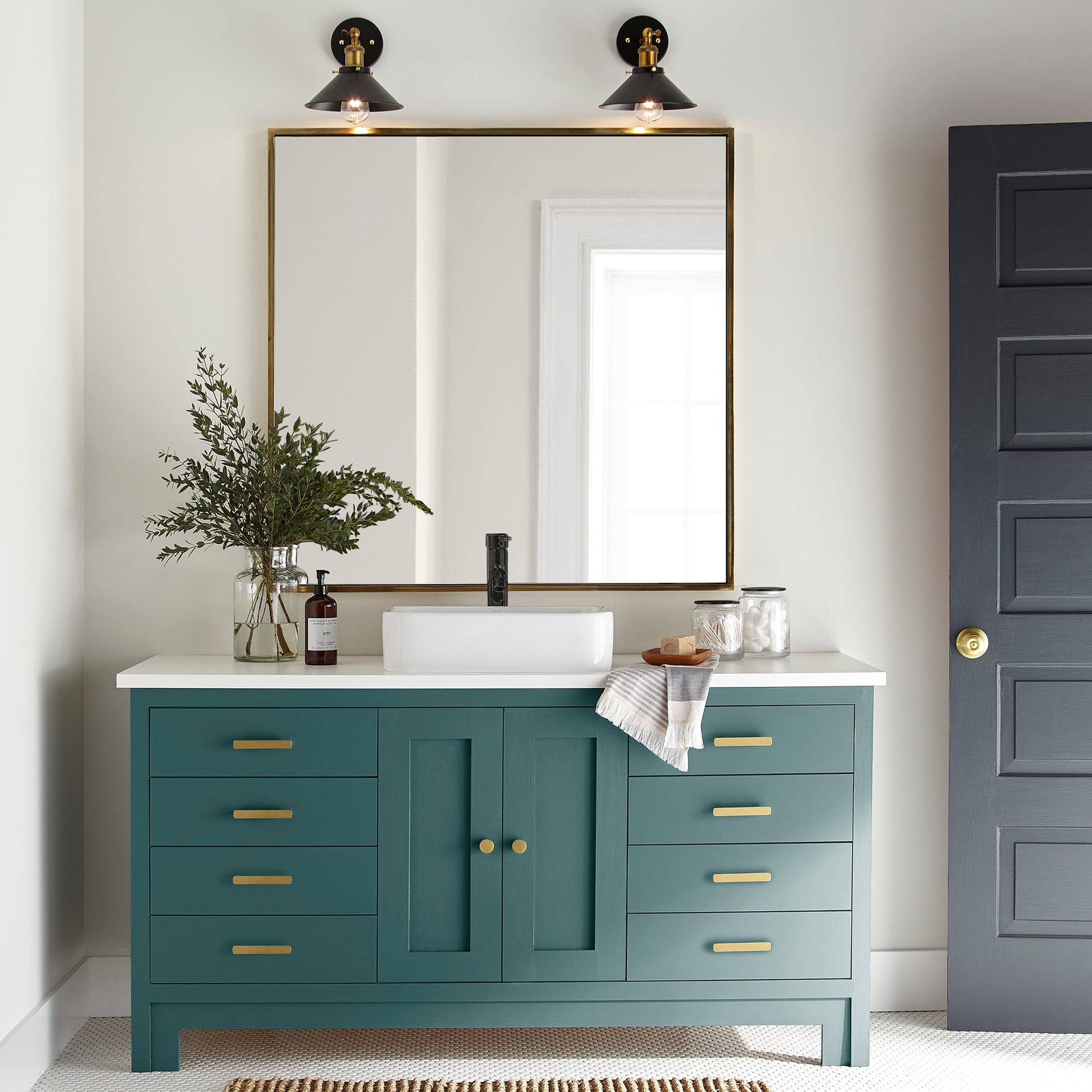 Blue and green combined to create an ashy peacock blue door and cabinet paint named water garden shown painted on bathroom cabinet