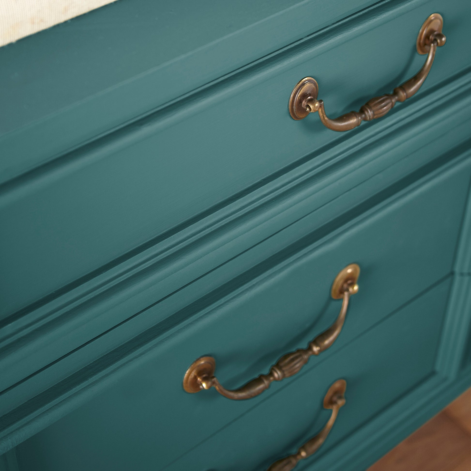 Blue and green combined to create an ashy peacock blue door and cabinet paint named water garden shown painted on cabinet